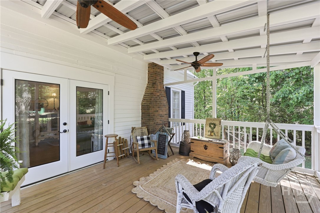 Side Porch off living area with porch swing