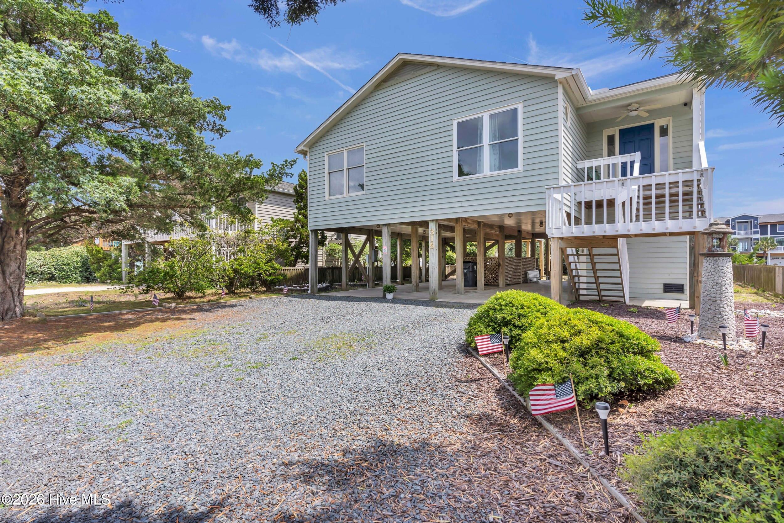 Coastal Living Starts Here! Welcome to your slice of paradise on Holden Beach, where sunrises and sunsets paint the sky and coastal breezes whisper relaxation. Nestled just three rows back from the sand and surf, this classic cedar-sided beach house on pilings offers the best of both worlds--secluded comfort and easy access to the shoreline. With two public beach access points just steps away, you'll be toes-in-the-sand in minutes. Whether you're sipping coffee on the spacious deck with glimpses of the Atlantic or walking home from an afternoon shell hunt, this home invites you to slow down and savor the coastal lifestyle. Inside, it's being sold furnished (with a few exceptions), making it ready to enjoy as a turnkey second home, a high-potential vacation rental, or a year-round residence. Holden Beach is beloved for its quiet charm, family-friendly vibe, and unique south-facing coastline - one of the few places on the East Coast where you can watch both sunrise and sunset over the water. Don't miss your chance to own a home that offers not just a place to stay, but a way to live.