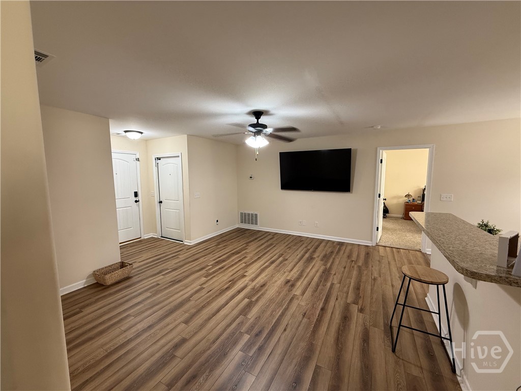 Living room, coat closet at entry, and 2 car garage.