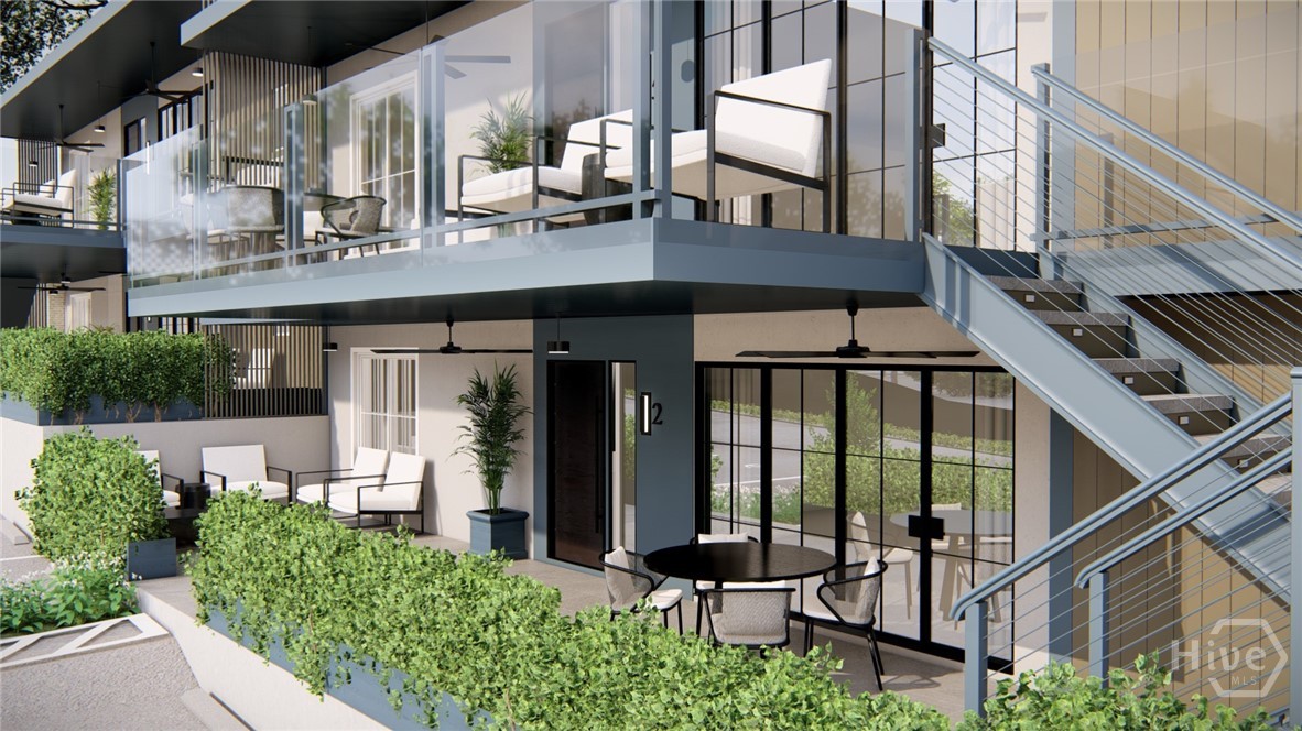 Nestled in Athens’ most coveted neighborhood, 1554 South is an exclusive collection of just seven luxury condominiums offering a rare opportunity. Thoughtfully designed for elevated living, each residence blends timeless architecture with modern elegance - set against the vibrant backdrop of local favorites, unmatched charm, and easy proximity to everything you love about Athens. Each residence comes with refined finishes including designer smart lighting with integrated control systems, gourmet appliances - SubZero, Wolf - French Oak hardwood flooring, custom cabinetry, Walker Zanger tile, 83” smart TV and Sonos surround. All owners will have one designated parking space per bedroom, private storage lockers, private balconies, and access to a rooftop deck with fully covered bar, TV, and private liquor locker storage. Elevated living with expansive volume and natural light. These upper-level residences include two bedrooms, two full bathrooms, and a versatile bonus room that can serve as a dining area, office, or third bedroom. Juliette balconies off both bedrooms and a private patio off the living room accessed by double steel and glass doors create the perfect indoor-outdoor flow, while 10-foot ceilings add a sense of openness and elegance. Additionally, residents will enjoy an exclusive partnership with Five and Ten offering VIP reservation access and access to exclusive events. Hawthorne House Interiors offers full furnishing packages at three different levels for ease of ownership. Property is currently under construction with an anticipated finish date of late March 2026. Photos are renderings.