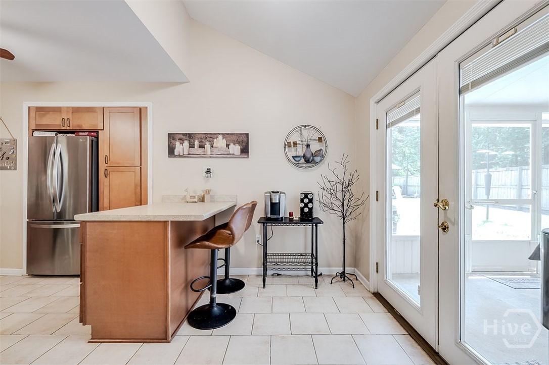 The kitchen area is just off the dining room and a double door access to the large screened porch. There is room for a small kitchen.