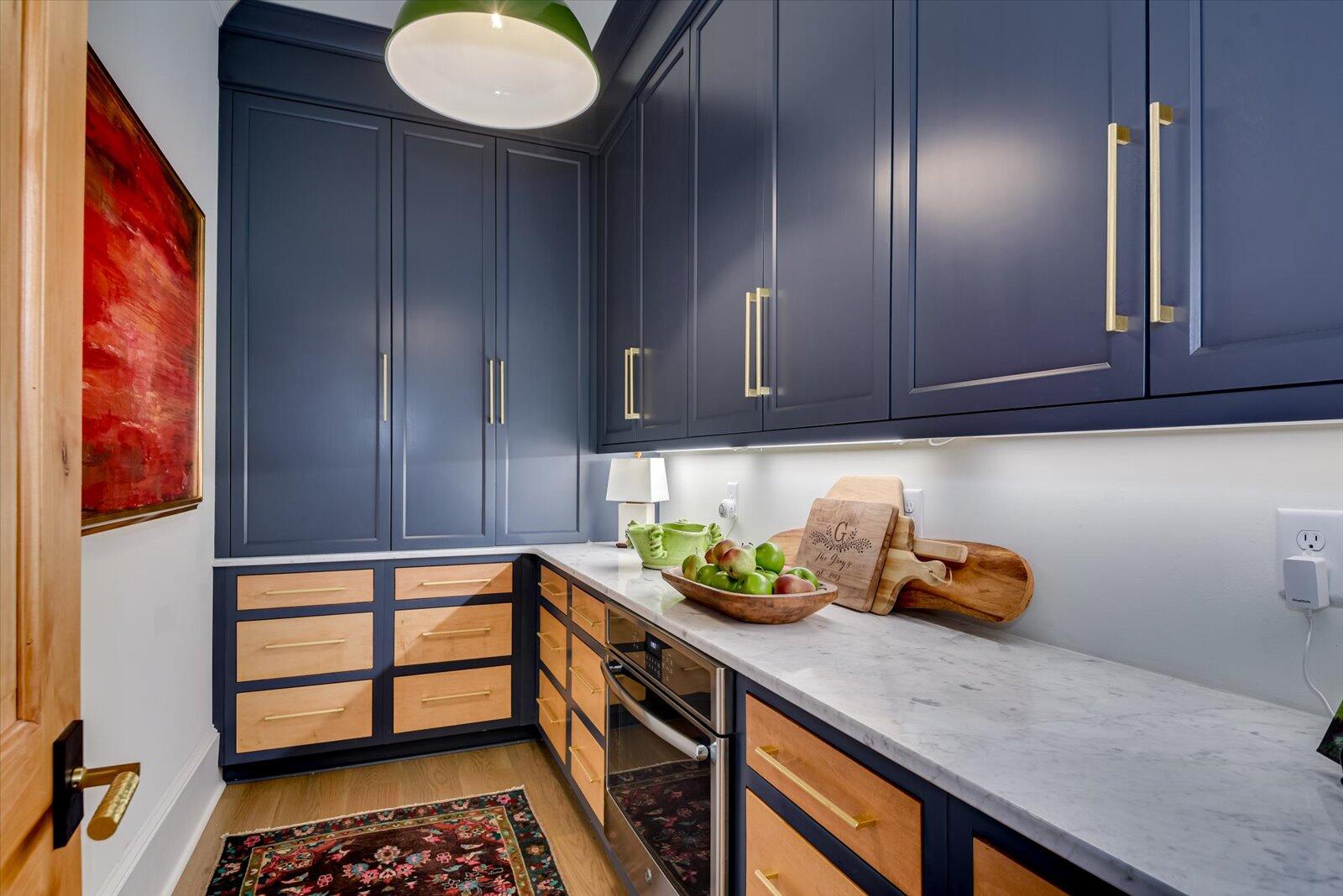 Pantry-GE built in oven. Maple cabinets-floor to ceiling. Custom pine entry door.