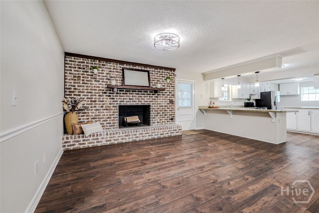 440 Pecan fireplace and kitchen view