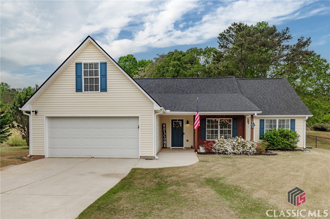 Tucked nicely on a cul-de-sac in the Nunnally Forest neighborhood, 1217 Nunnally Drive offers a comfortable and functional layout with plenty of space both inside and out. This three-bedroom, two-bathroom ranch-style home sits on a level 0.7-acre lot and features an open floor plan that makes everyday living easy. The living room has tall ceilings and a wood-burning fireplace, and flows into the kitchen.  The kitchen has been updated with granite countertops, a tile backsplash and has plenty of cabinet storage, counter-height seating and room for a casual eat-in area.  There is a separate dining room, that also would function well as a home office. The split-bedroom layout includes a large primary suite with a walk-in closet, trey ceiling, garden tub, and separate shower on one side of the home, and two additional bedrooms share a full bath on the opposite side of the home. Upstairs, a bonus room offers flexible space for an office, playroom, or additional bedroom.The fully fenced backyard includes a patio that's great for grilling or relaxing. A true two-car garage provides additional storage and parking. This home is conveniently located off Ga Hwy 138 for easy access to many surrounding areas. It's also close to sought-after schools, shopping, and restaurants. Newer roof with lifetime shing and newer HVAC! Move-in ready and very well maintained, a well-kept neighborhood, and a smart layout, 1217 Nunnally Drive is a great option for anyone looking to settle in Monroe!