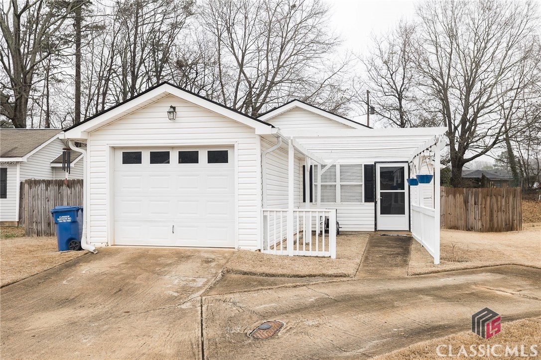 Adorable Athens, GA cottage home in Buckingham Terrace! This move-in ready home features 3 bedrooms, 2 bathrooms, and 1204 sq ft of living space. Enter the home into a vaulted living room open to the dining area. Around the corner, you will find a completely updated kitchen with new cabinets and quartz countertops. The flooring in the home has been newly installed with a combination of laminate and carpeting in the bedrooms. The primary suite has a vaulted ceiling and a walk-in closet. There are two more bedrooms across the hall with a shared bathroom. There is a bonus storage room in the center of the house across from the laundry. Off the dining room are sliding glass doors leading to a patio and a large back yard, including a fire pit, wooden privacy fence, and storage building. Located just 4 miles from Piedmont Athens Regional, 10 miles from the University of Georgia, and minutes from the new Publix shopping center opening soon. This home is convenient to all that Athens offers.