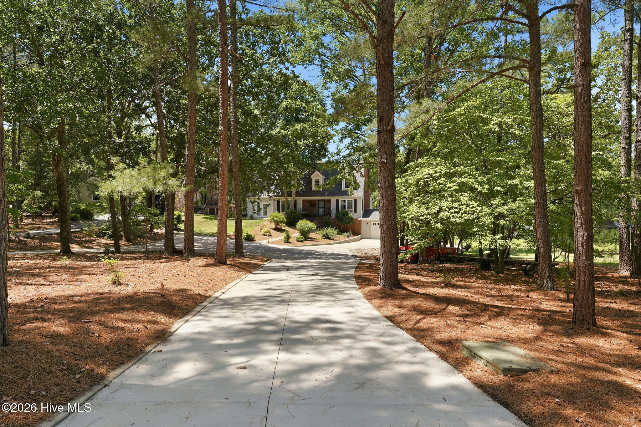 Left side driveway to enter the home. Plenty of parking area.