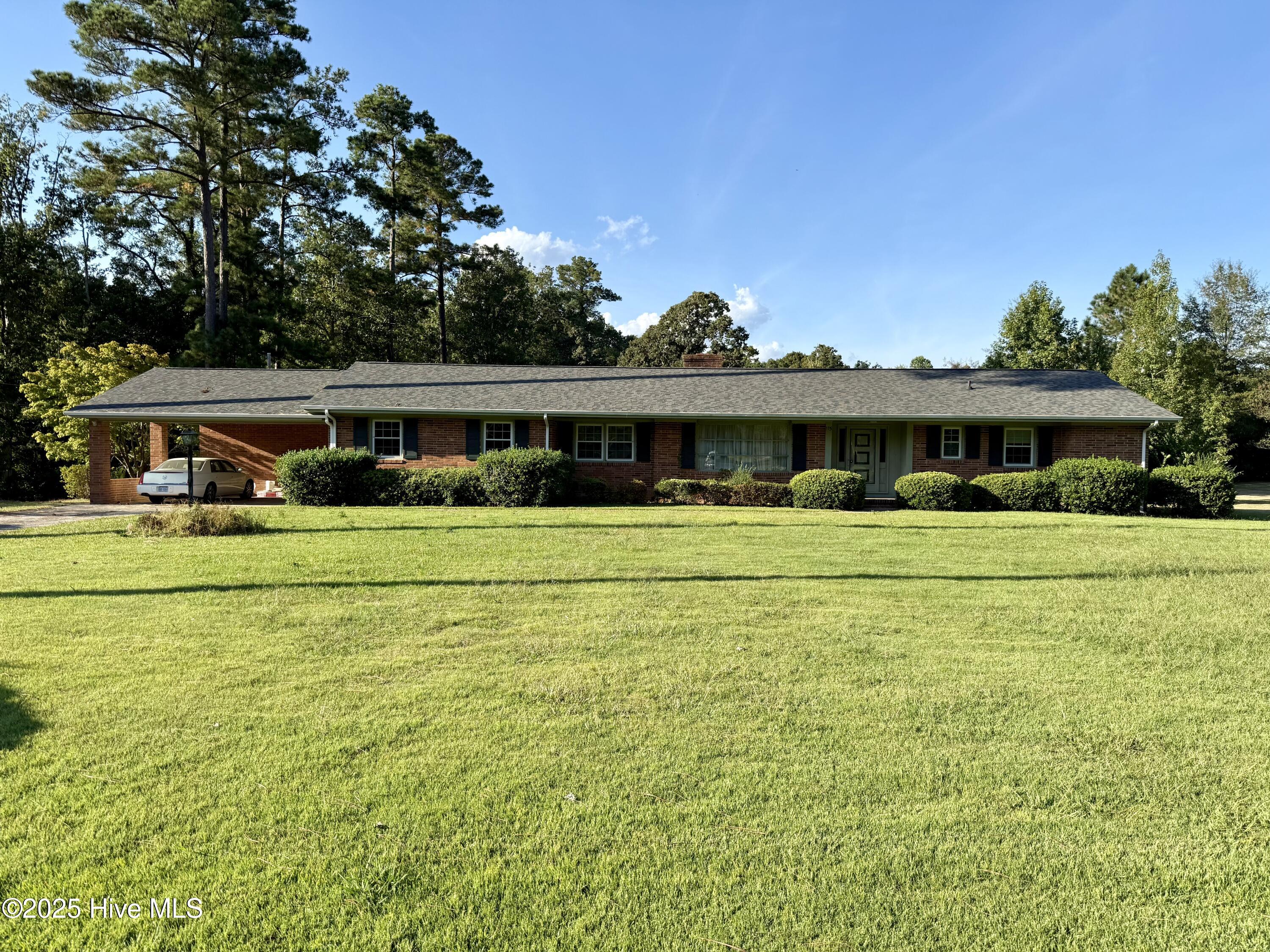 Discover your peaceful retreat in the charming town of Plymouth. This beautiful 3-bedroom, 2.5-bath brick ranch home offers the best of Eastern North Carolina living, located just 1.5 hours from the sparkling Crystal Coast.
Step through the grand foyer into a warm and inviting home designed for both comfort and entertaining. The floor plan flows from a formal living room into a separate, cozy den featuring a fireplace with gas logs—perfect for relaxing evenings. Host memorable dinners in the formal dining room, conveniently situated near the well-equipped kitchen, which includes all necessary appliances and a cheerful breakfast nook for casual meals.
This home offers incredible flexibility with a large bonus room complete with built-in storage cabinets and a private half-bath for guests. It's the ideal space for a home office, playroom, or media center. The bedrooms feature original hardwood floors, with additional hardwood believed to be preserved under the carpet in other areas, adding timeless character.
Outside, the large yard provides ample space for outdoor games, gardening, and enjoying the fresh air. A small outbuilding is available for your storage needs, while the attached double carport includes an outside utility room, adding extra convenience.
Embrace a serene lifestyle in this wonderful home. Come see all it has to offer today