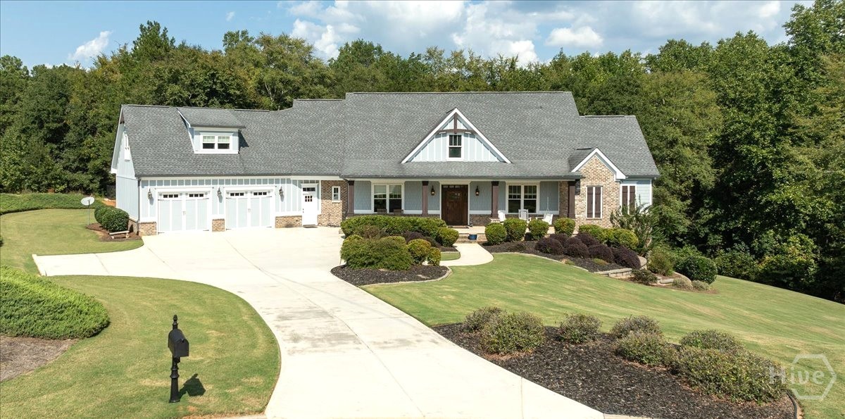 A truly exceptional custom estate where timeless elegance, sophisticated design, and private luxury come together on more than 2 acres. This stunning 4-bedroom, 4.5-bath residence offers an expansive open-concept floor plan designed for both comfortable everyday living and effortless entertaining.At the heart of the home, the chef-inspired kitchen features two impressive statement islands, granite countertops, abundant cabinetry, an extended pantry with refrigerator, and beautiful ambient lighting. The thoughtfully designed floor plan includes two generously sized bedrooms on the main level, offering flexibility for guests or multigenerational living.The luxurious primary suite provides a private retreat with a spa-inspired bath featuring dual vanities, an oversized custom shower, and an expansive oversized closet. A welcoming living room with a beautiful fireplace creates the perfect setting for relaxing or entertaining.Outside, more than 2 acres provide exceptional privacy and space to entertain, garden, play, or simply enjoy the peaceful surroundings in your fenced in back yard. An oversized deck offers an inviting setting for outdoor dining and gatherings, while the covered front porch provides another place to relax and take in the scenery.Complete with a two car garage and abundant storage, this remarkable property offers a rare combination of elegance, privacy, space, and comfort.