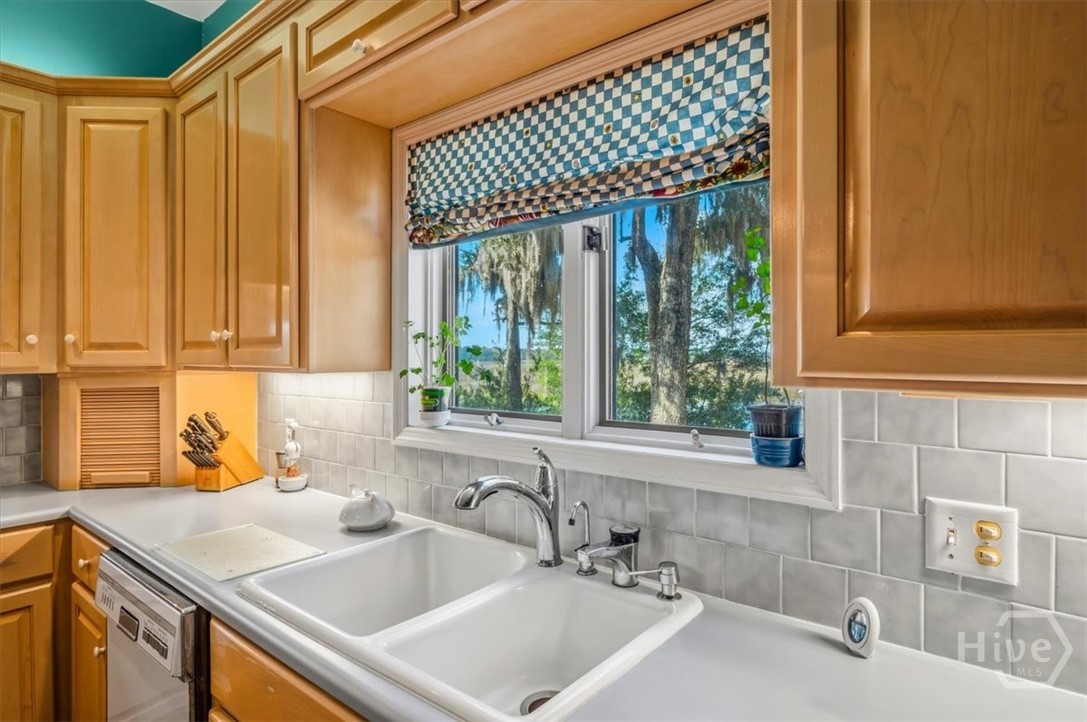 View from Kitchen, tiled backsplash and instant hot water.
