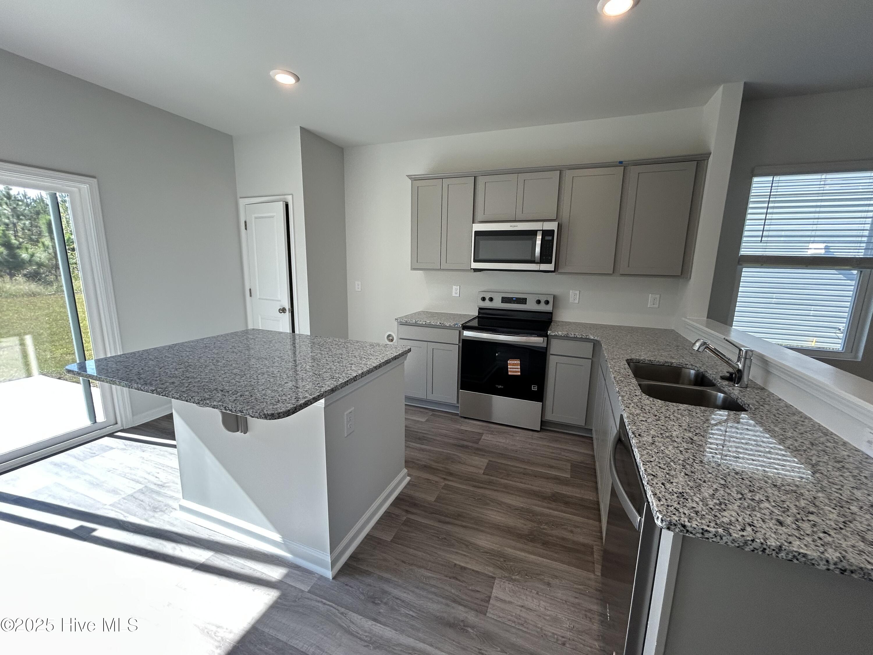 568 Coronado Avenue SE 16, Leland, NC 28451 – photo 7: Kitchen with Stainless Steel Appliances