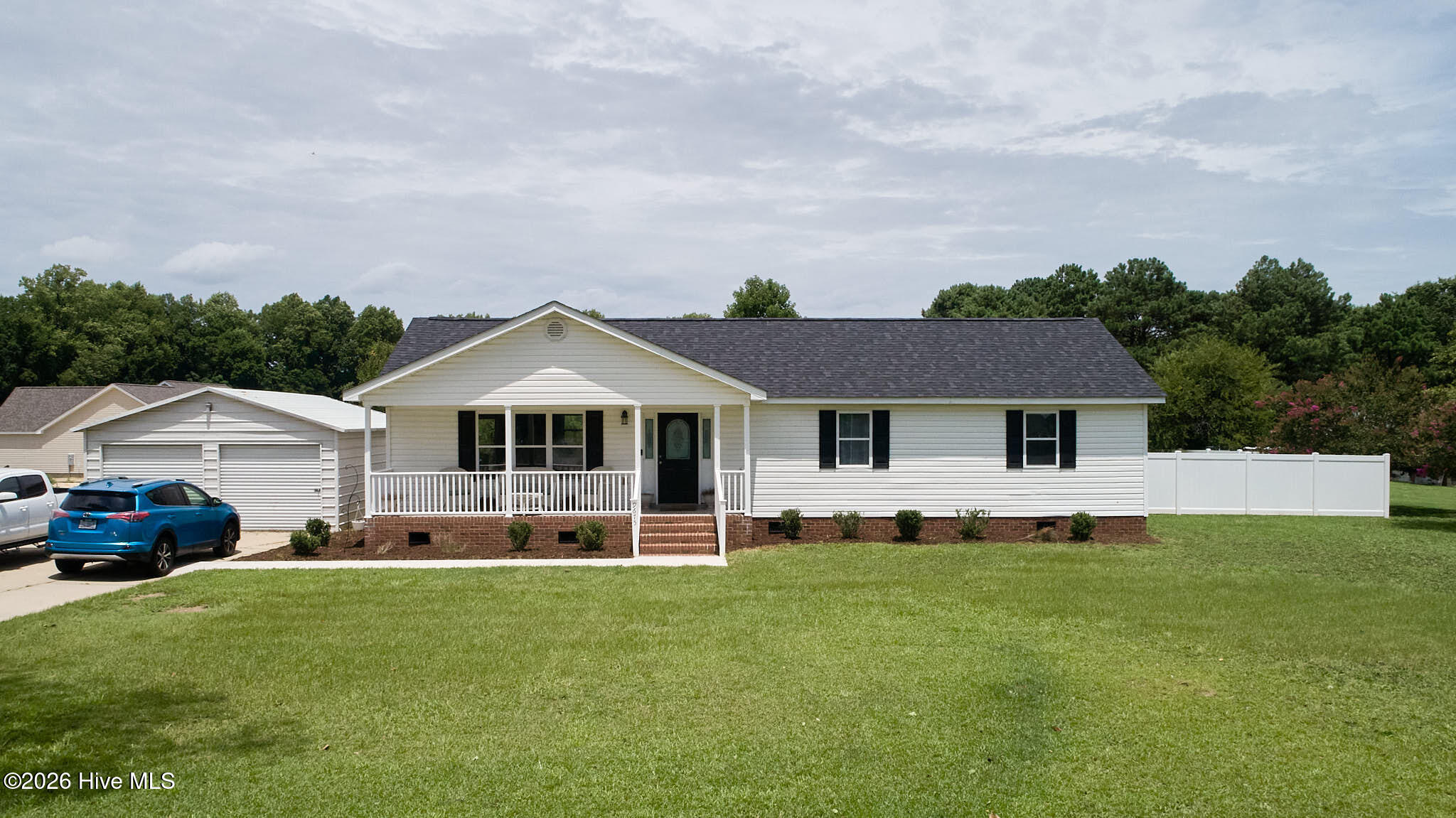 This beautifully updated 3-bedroom, 2-bathroom home sits on over an acre and features two detached 2-car garages--perfect for a workshop or hobbyist. Enjoy peaceful views from the covered front porch or patio. Inside features updates galore(2024): a brand-new HVAC system, new roof shingles, fresh interior paint, new laminate flooring, and stylish new light fixtures. The kitchen is a chef's delight with new quartz countertops, freshly painted cabinets, a walk-in pantry, and a new stove and dishwasher. Retreat to a primary suite with plush new carpet, a walk-in closet, and an upgraded private bath. Two additional bedrooms share a full hall bath boasting new LVT floors and quartz counters. Move right into your turnkey Home Sweet Home in the countryside!