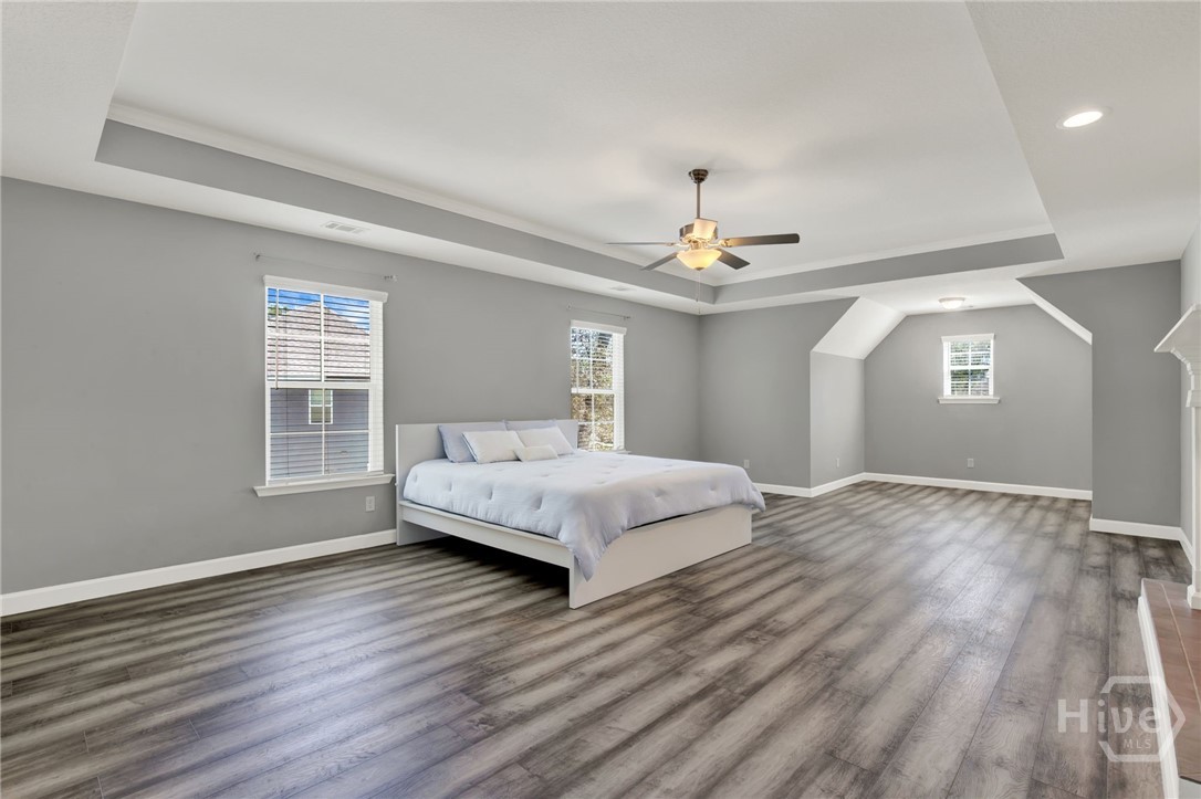 Expansive Primary Suite with Sitting Area and Fireplace