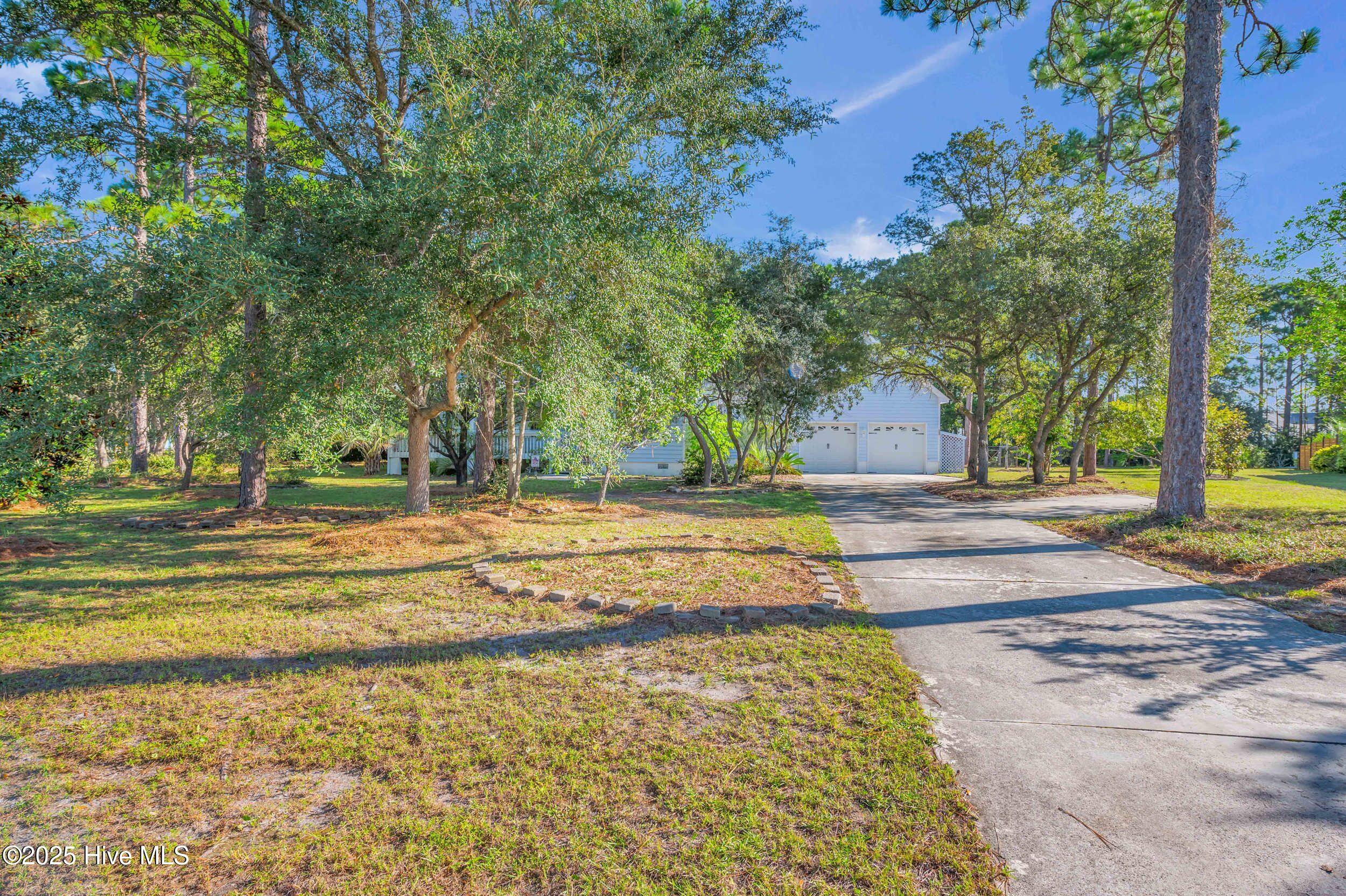 3006 Robert Ruark Drive SE, Southport, NC 28461 – photo 3: 1_3006 robert ruark dr-00001