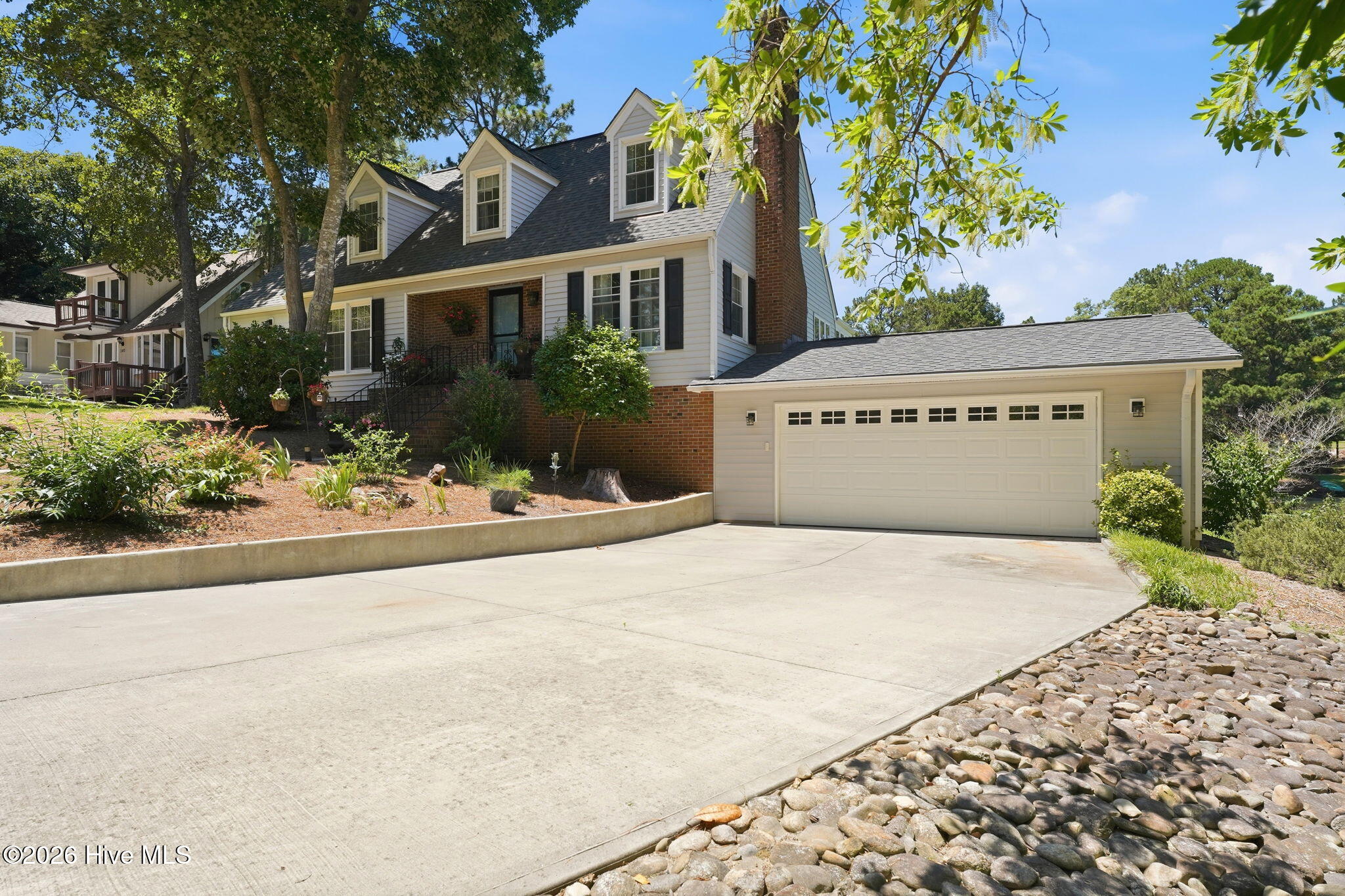 Side view of home with a double car garage.