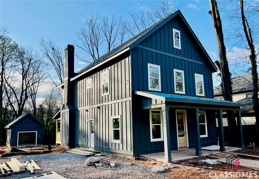 Five-Points Stylish New Construction, 3 bed/2.5 bath, with office/flex space, in 2,174 sq ft Contemporary Home with 417’ of porches, a detached 1 car garage, and fenced backyard, on a .33 acre lot, located just 4 blocks from the Five-Points Commercial district ( with it’s array of delicious restaurants ), and traveling 2 blocks further, one arrives upon UGA’s beautiful main campus. Also, it’s a straight path along Lumpkin Street, through the heart of campus, into Historic Downtown. Upon entering the front door, one encounters an impressive open staircase with 20’ ceiling, and there’s an office/flex space immediately to the left. Traveling down a short hallway, one arrives in a large open common living area: a living room with tiled gas fireplace/mantle, a dining area, and a lovely kitchen with large island, granite counters, tile back splash, vent hood, stainless appliances, including gas range, custom cabinets, and pantry. The flooring on this level will be Hickory, providing aesthetic warmth. There are double French doors that open from this area to a large back porch, overlooking a fenced, fairly private, back yard. There will be a gas connection on back porch to facilitate outdoor cooking/grilling. There’s a driveway side door, to a small hallway with built-in bench seat, laundry closet, and 1/2 bath. Upstairs, there’s a hallway connecting to 3 bedrooms, 2 tile baths, including a large master suite overlooking back yard, with stylish bath, and large walk-in closet. Currently, the house is under construction, scheduled for an April 1, 2023 completion. Refer to House Plans and Design Selections for insights into the vision of this Home, being built by Award-Winning, J W York Homes.