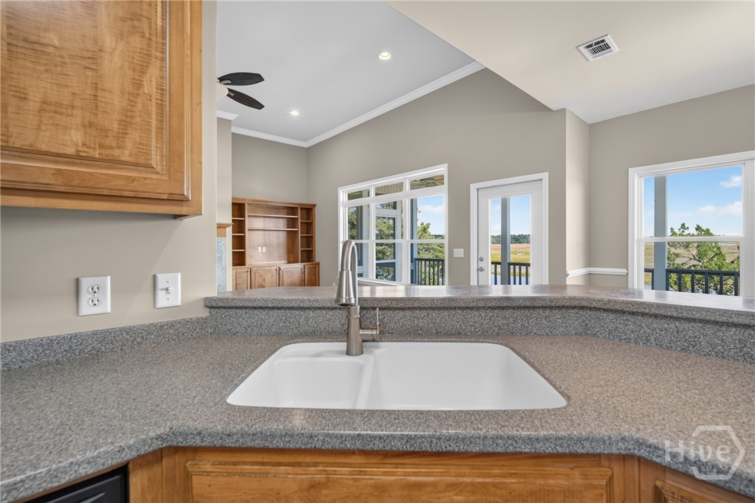 Kitchen sink looking into living room