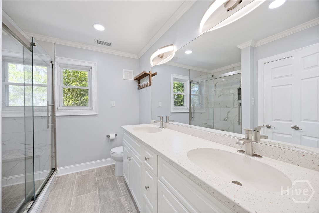 Updated bathroom with dual vanities, clean finishe