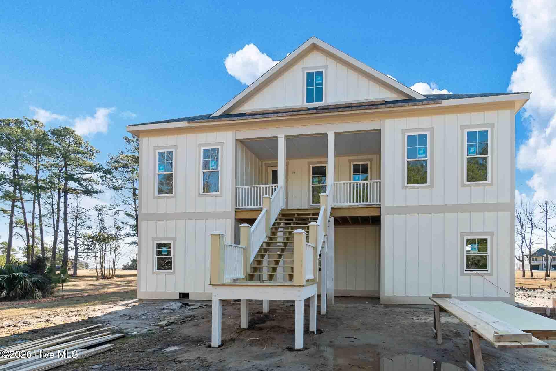 Experience the Ultimate in Coastal Living! This is the best deal with water views in the community! Currently under construction, this 3-bedroom, 3-bath home is nestled in Oriental, North Carolina's sailing capital. The home delivers panoramic water views in a premier Neuse Riverfront neighborhood—just minutes by boat to the Pamlico Sound and Intracoastal Waterway. Designed for elegance and comfort, highlights include: A spacious master suite retreat with a luxurious tile shower Granite countertops, solid wood cabinetry, and custom lighting throughout. Beautiful wood flooring, with plush carpet in bedrooms and durable LVP in high-traffic areas Light-filled open living spaces that flow seamlessly to a generous covered porch—perfect for soaking in breathtaking sunsets With a two-car garage below and elevator-ready construction, this home blends convenience with timeless coastal style. Customize your outdoor living with optional upgrades like a summer kitchen or refreshing outdoor shower. Expertly built by Coastal Heritage Construction, Kim Willis and her team, this residence is more than a home—it's a lifestyle on the water.