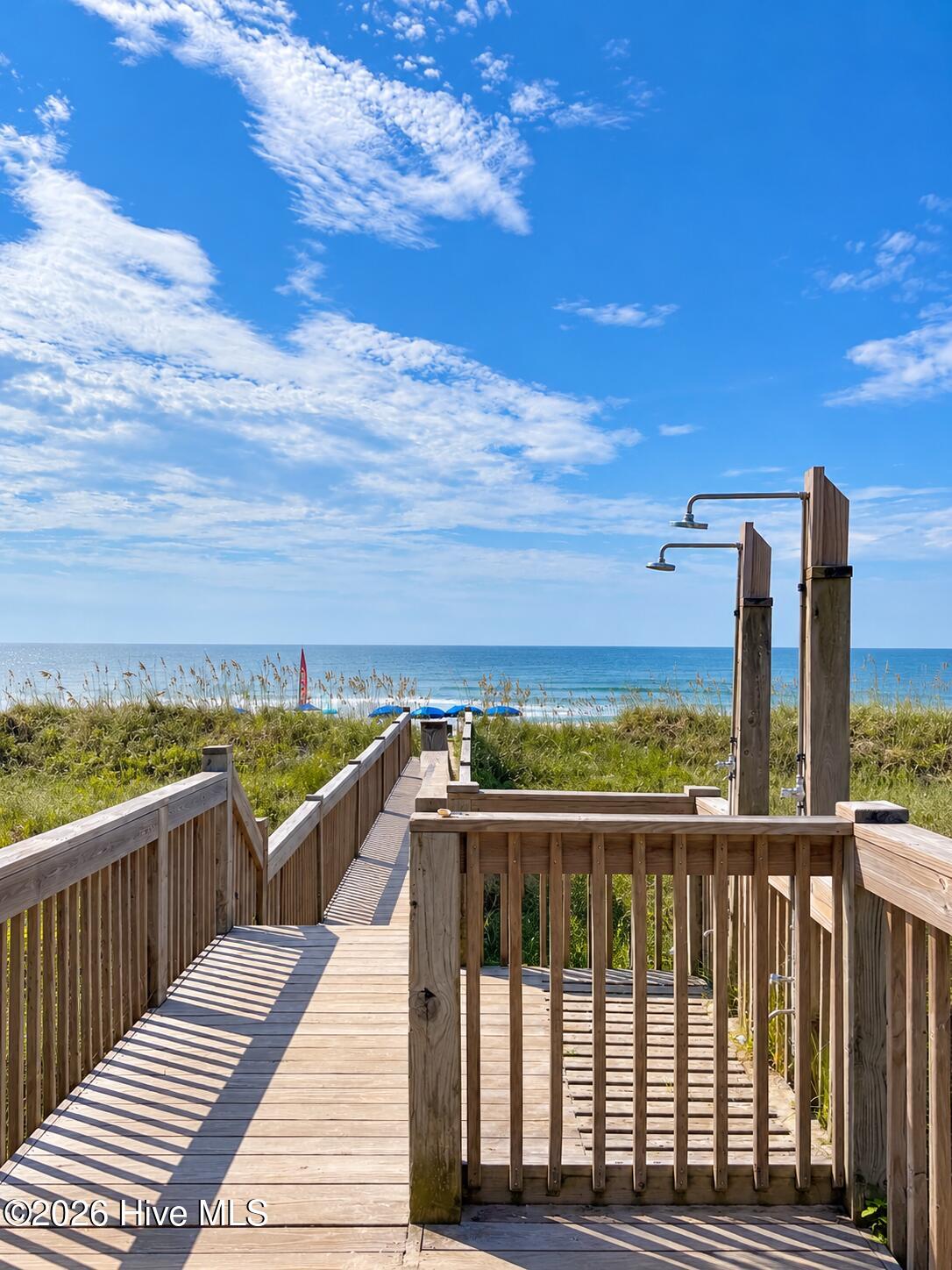 Oceanfront club house and pool with private beach access.