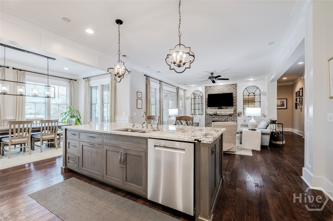 Kitchen is open to dining and living spaces