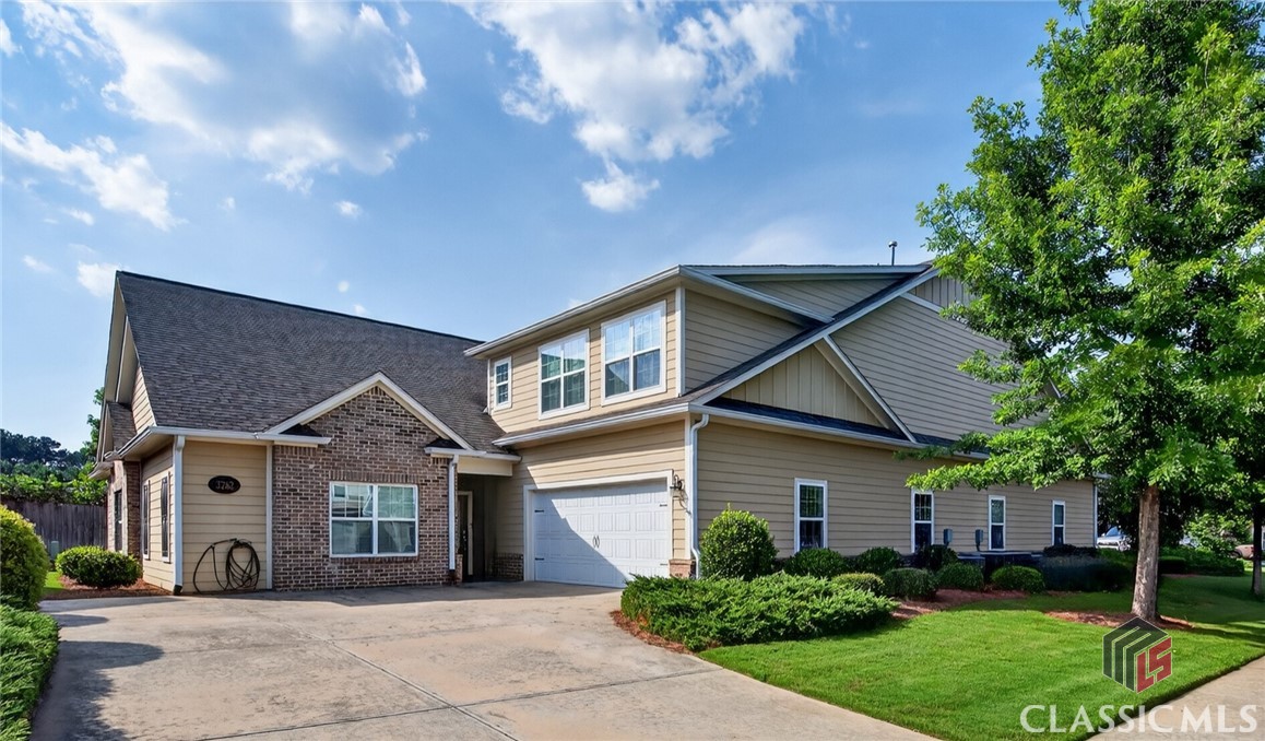 Welcome to 3262 Orchard Circle, where low-maintenance living meets comfort and elegance at the Cottages at Creekside. This beautifully maintained home offers an inviting community feel, a smart, spacious layout, and high-end finishes throughout. Built in 2015 and kept in great condition, this home is move-in ready with exterior maintenance handled by the community association. Designed for easy living, the main level features an open floor plan with handicap-accessible rooms, a large living area, a dedicated dining space, and a cozy breakfast nook or keeping room. French doors from the great room lead to a covered sunroom, which has been insulated and enclosed, with sun shades that can be drawn down—perfect for enjoying quiet mornings or relaxing evenings outdoors at any time of the year.  The kitchen is the heart of the home, featuring upgraded cabinets, a large island with counter-height seating, granite countertops, a beautiful tile backsplash, stainless appliances, and a spacious walk-in pantry. A powder room and laundry room are located off the wide hallway leading to the two-car garage. Past the garage entry, you'll find a tiled storage room—ideal for a mudroom setup or temperature-controlled storage space. Two secondary bedrooms on the main level share a full hall bathroom, while the owner’s suite is tucked privately at the back of the home. The owner’s retreat boasts tray ceilings, a luxurious ensuite with a large shower, soaking tub, double vanity, water closet, and an oversized walk-in closet. Upstairs, a fully finished second level offers even more flexibility, featuring a very large bedroom and bonus space with a full bathroom and two spacious walk-in closets. This space is perfect for a private guest suite, home office, hobby room, or bonus living area. This condo has a private driveway with ample parking.  Enjoy access to fantastic amenities, including two pools, tennis courts, a fitness center, and a community clubhouse. Located just minutes from shopping, restaurants, and entertainment in both Athens and Oconee County, 3262 Orchard Circle offers the perfect blend of comfort, convenience, and community. Don't miss this rare opportunity for easy, elegant living at the Cottages at Creekside!