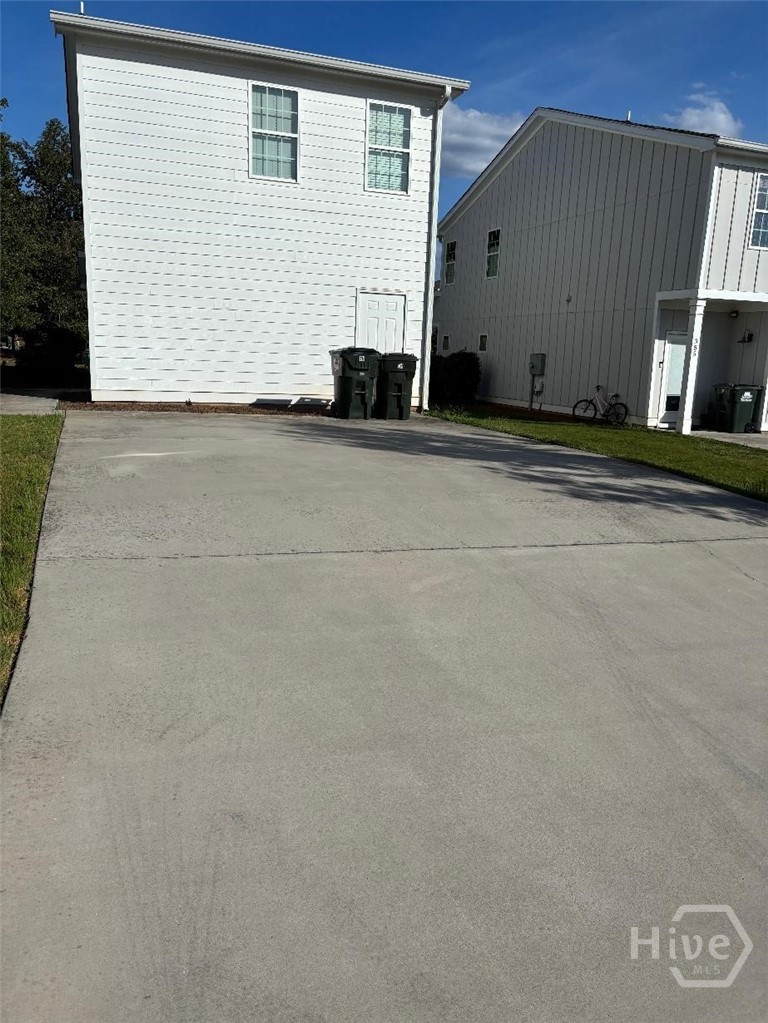 Private parking pad and storage room.