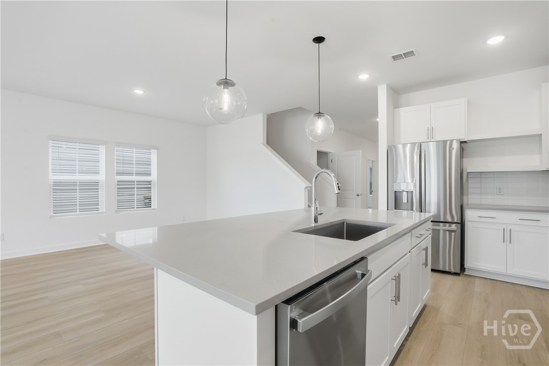Image shown for design reference. Actual home will feature gray cabinetry with Carrera Miska Countertops. See sales consultant for details.