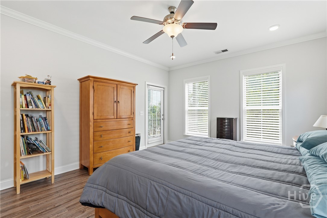 primary downstairs bedroom with access to back porch.