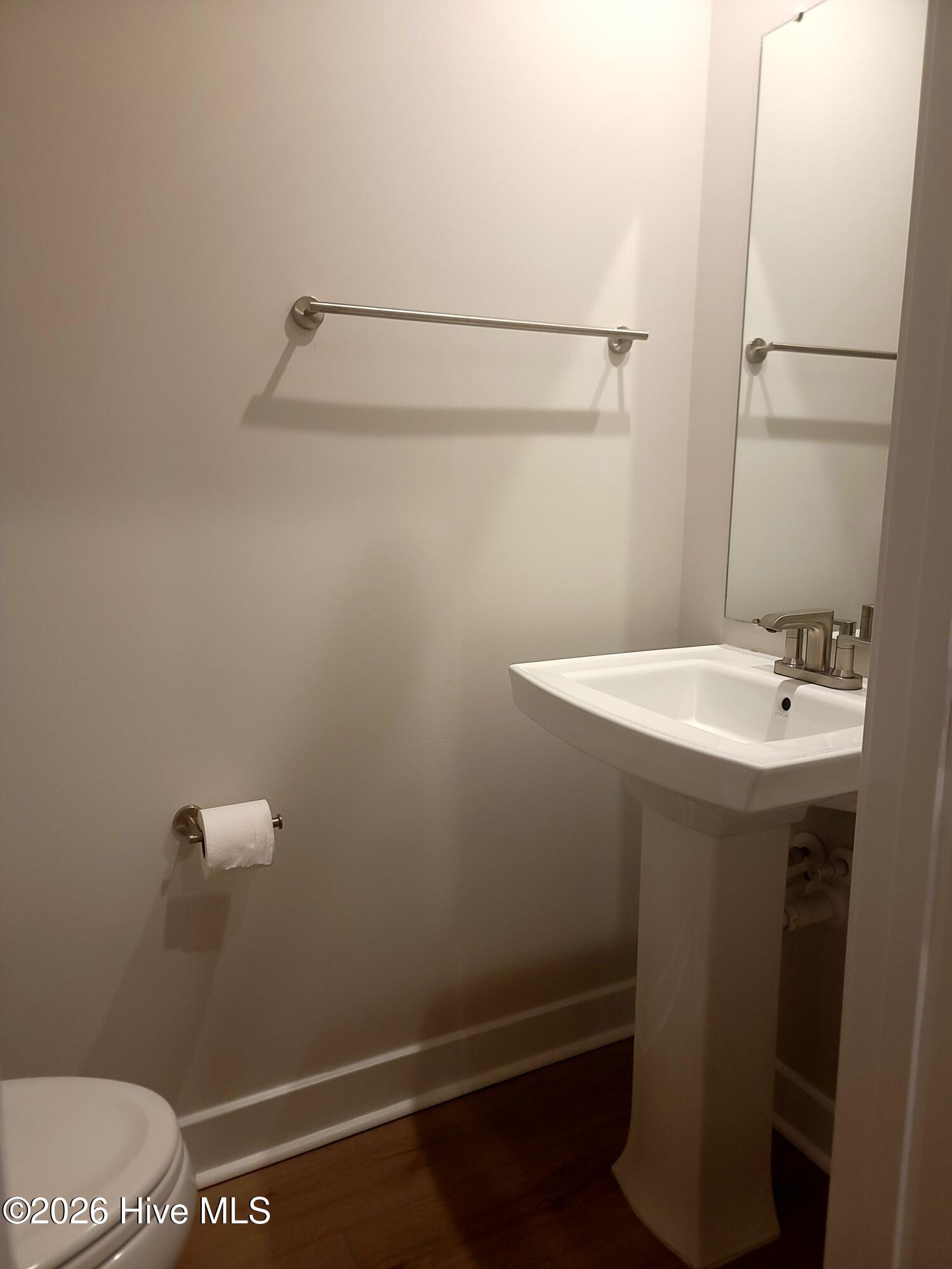 Powder Room on the main level between the kitchen and living room. Great location for guest bathroom.