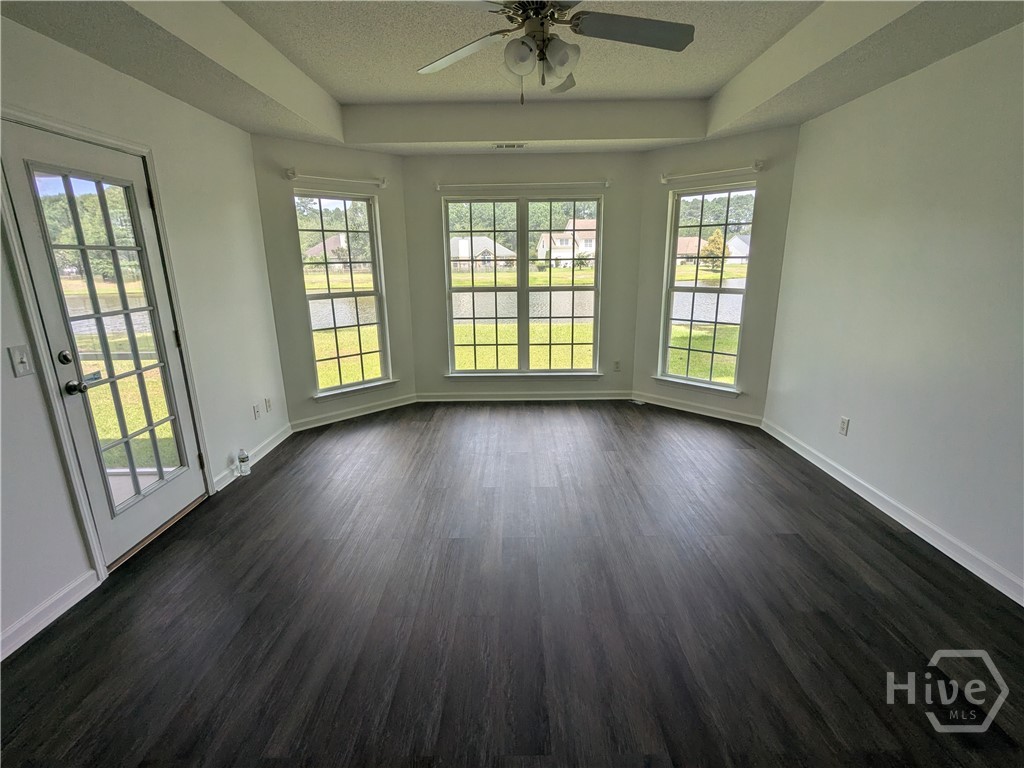 Master bedroom with bay window and view of the lagoon.