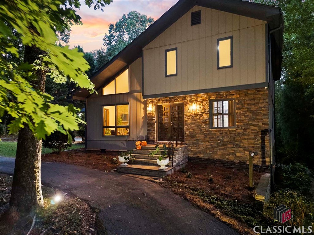 Calling all enthusiasts of contemporary architecture! Welcome to 238 Moss Side Drive, located in the heart of one of Athens’ quieter West Side neighborhoods, Moss Side. Nearby homes in the subdivision have sold at higher price points, leaving ample opportunity to make further customizations to this home without the fear of over improvement. That said, this home has seen its fair share of improvements during the current ownership to include stylishly updated bathrooms and primary suite, new roof, and added office space making it very easy to love this unique home exactly as it is today. Built in 1977, this property offers a delightful mid-century design with a sunken living room featuring tons of large windows, stacked stone fireplace and vaulted ceiling that draws the eye to the upstairs balcony. Pair this space with views of the mature trees in the front yard, and it’s almost like being in the mountains of Northeast Georgia. Go ahead and throw that “Rumors” vinyl by Fleetwood Mac on the record player - you know you want to!With 5 bedrooms and 3.5 bathrooms, a finished basement, and studio apartment, this home provides ample space for family and guests. Sited on nearly an acre of mostly wooded land, this home seamlessly integrates with nature. An updated kitchen features stainless steel appliances, butcher block countertops, and a pantry with laundry hookups. One could easily recess the refrigerator in the existing pantry and add more cabinetry and counter space if desired. Step outside to discover a massive covered porch and wrap-around deck, perfect for entertaining friends and family. This expansive outdoor space offers a peaceful retreat for summer barbecues, sunset gatherings, or simply enjoying the lush, wooded surroundings. Under the covered porch, you’ll find a charming studio apartment with a private entrance, ideal for guests, an office, a creative space, or income producing opportunity. The home's large finished basement is a true bonus, also with a separate exterior entrance that could easily be transformed into an additional studio, a guest/ in-law suite, or a teenage hangout. Imagine the convenience of having a kitchenette area, creating a self-sufficient space for guests or family members seeking their own retreat. Situated in the desirable Moss Side neighborhood in Athens, you’ll be just minutes away from Bishop Park, Oak Grove retail and the new Publix, as well as Normaltown staples like Hi Lo Lounge, The Old Pal, Automatic Pizza, and Normal Bar, as well as the vibrant cultural scene that Athens is known for. The nearby University of Georgia offers a wealth of activities, from sporting events to art exhibitions, ensuring you’ll always have something to enjoy. Of note, the nearby UGA Health Sciences Campus will soon be transformed into the new medical school. HWY 129’s proximity makes it easy to pop over to Atlanta for the weekend or to catch a flight. Contemporary homes in Athens are a rare find, and this one in particular perfectly balances style, comfort, and functionality. Don’t miss your opportunity to call this stunning property home. Schedule your private tour today and experience the lifestyle that awaits you!