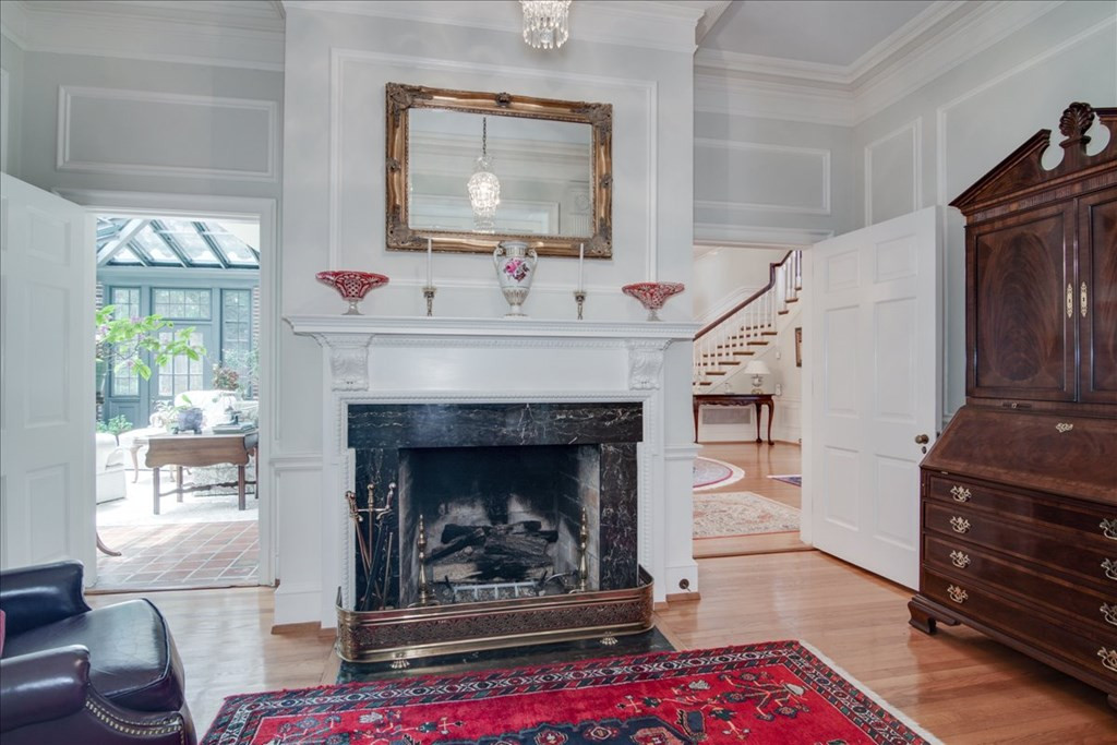 Parlor room with fireplace & built-ins