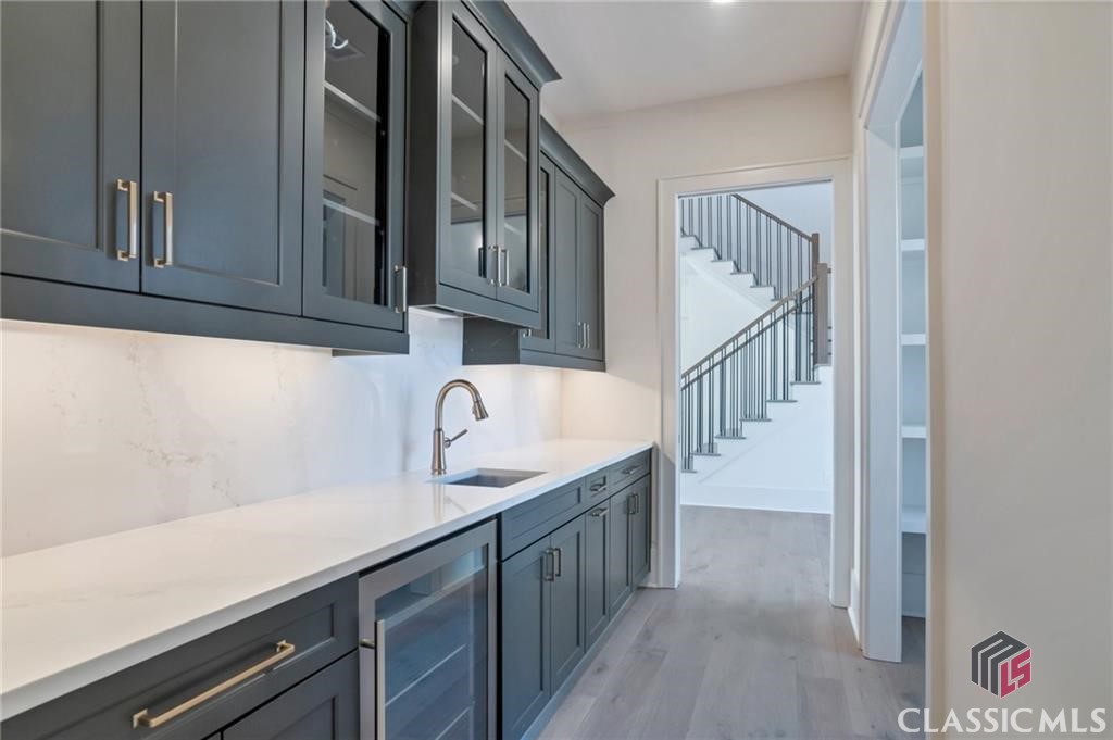 Kitchen - Butler's pantry with Beverage Cooler and Glass Cabinets