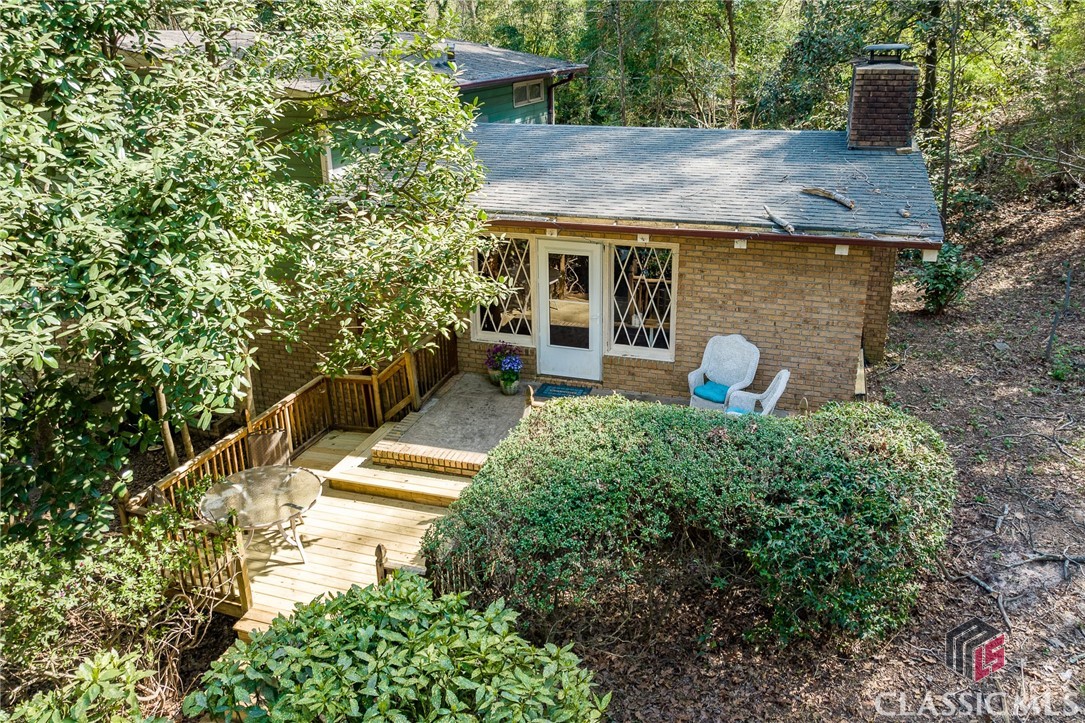 Tucked away in one of Athens' most desirable areas, this 1968 split-level home is full of potential and ready for its next chapter. Featuring classic architectural elements, including a stunning vaulted living room with tongue-and-groove ceilings, this home offers a solid foundation to create something truly special—at a price that can’t be beat in 5Points.If you're looking for a property where you can add value, this is the perfect opportunity. With four bedrooms and two bathrooms, the layout is both functional and flexible—three bedrooms share a full bath upstairs, while the lower-level primary suite enjoys its own ensuite bath. The kitchen is a blank canvas, offering endless possibilities to design a space that suits your vision without compromising on someone else’s choices.Step outside to discover an exceptional yard...the highlight of this property: flat, private, and complete with a charming creek running along the back of the property. The expansive deck provides the perfect spot to take in the peaceful, secluded setting. And if you love the setting and would like to add on to it, the adjacent lot is available for purchase in conjunction with the house.Whether you're an investor, renovator, or buyer with a dream, this is your chance to create something special in one of Athens' most sought-after neighborhoods. Don’t miss it! xx