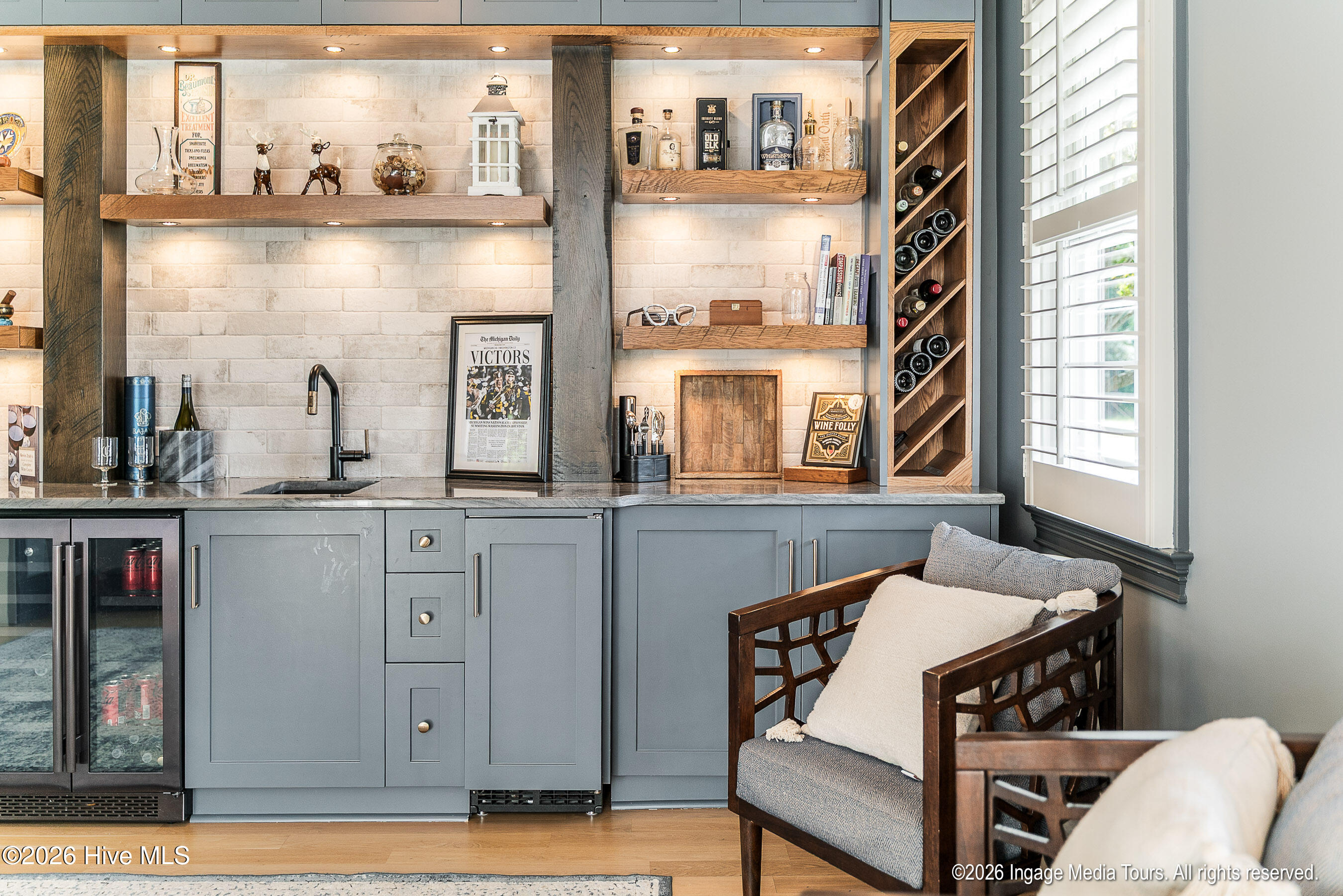 Wine storage, sink, fridge, ice -maker and more make this a great space to entertain.