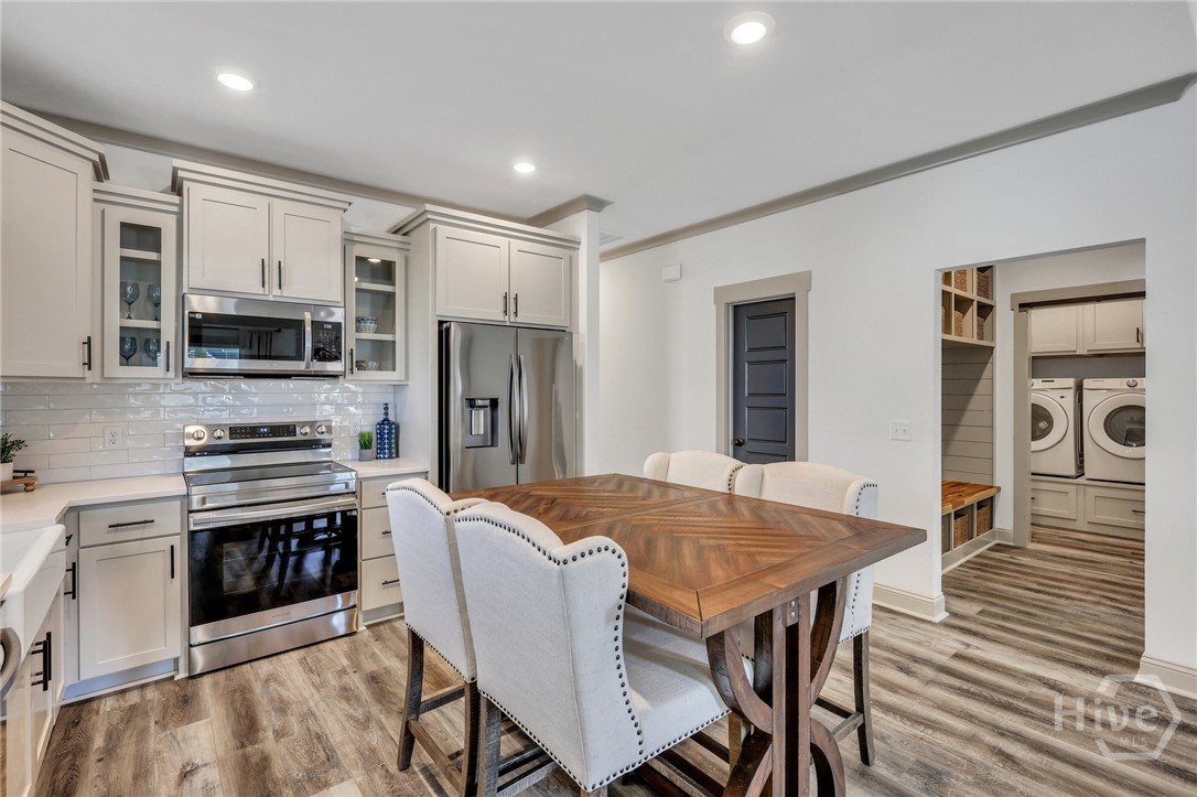 PHOTOS OF A PREVIOUSLY BUILT BRINSON PLAN BY LAWRENCE ALEXANDER HOMES.