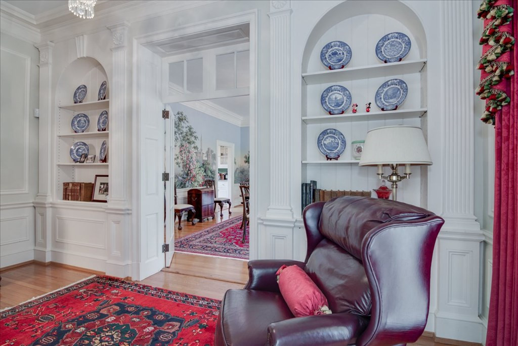 Parlor room with fireplace & built-ins