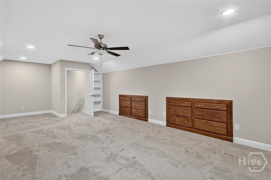 Don't miss the storage closet behind the custom built book case