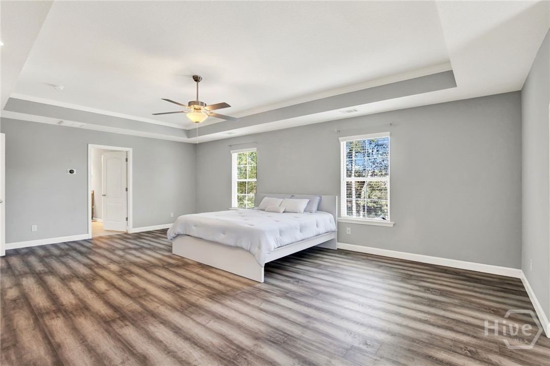 Expansive Primary Suite with Sitting Area and Fireplace