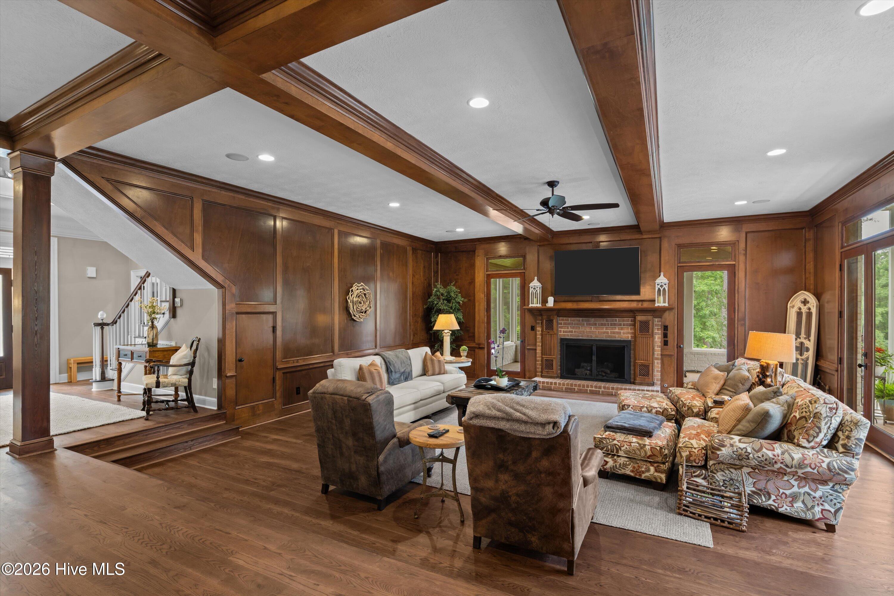 Sunken living room with gas fireplace, beautiful wood molding