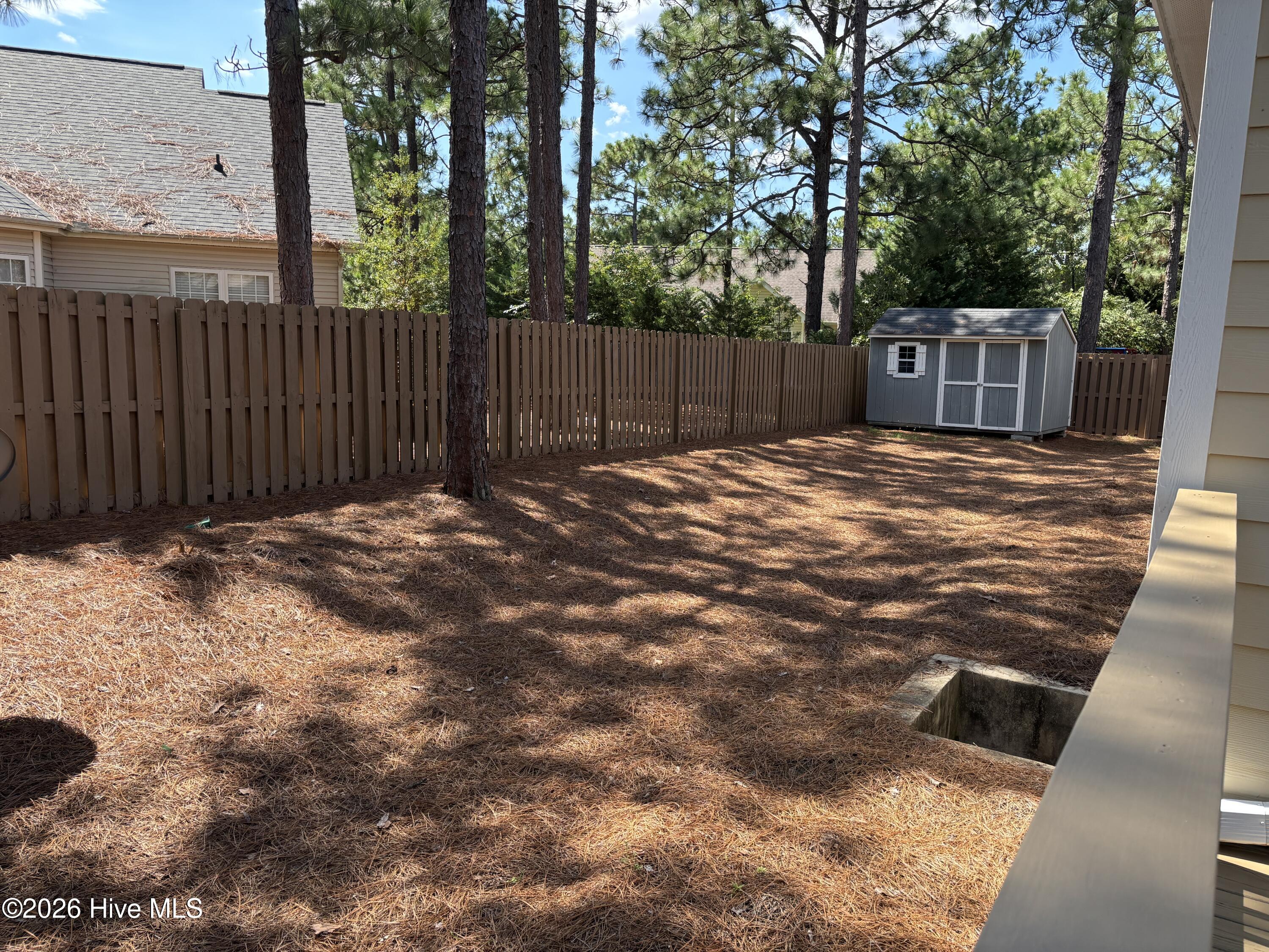 Back yard with storage building