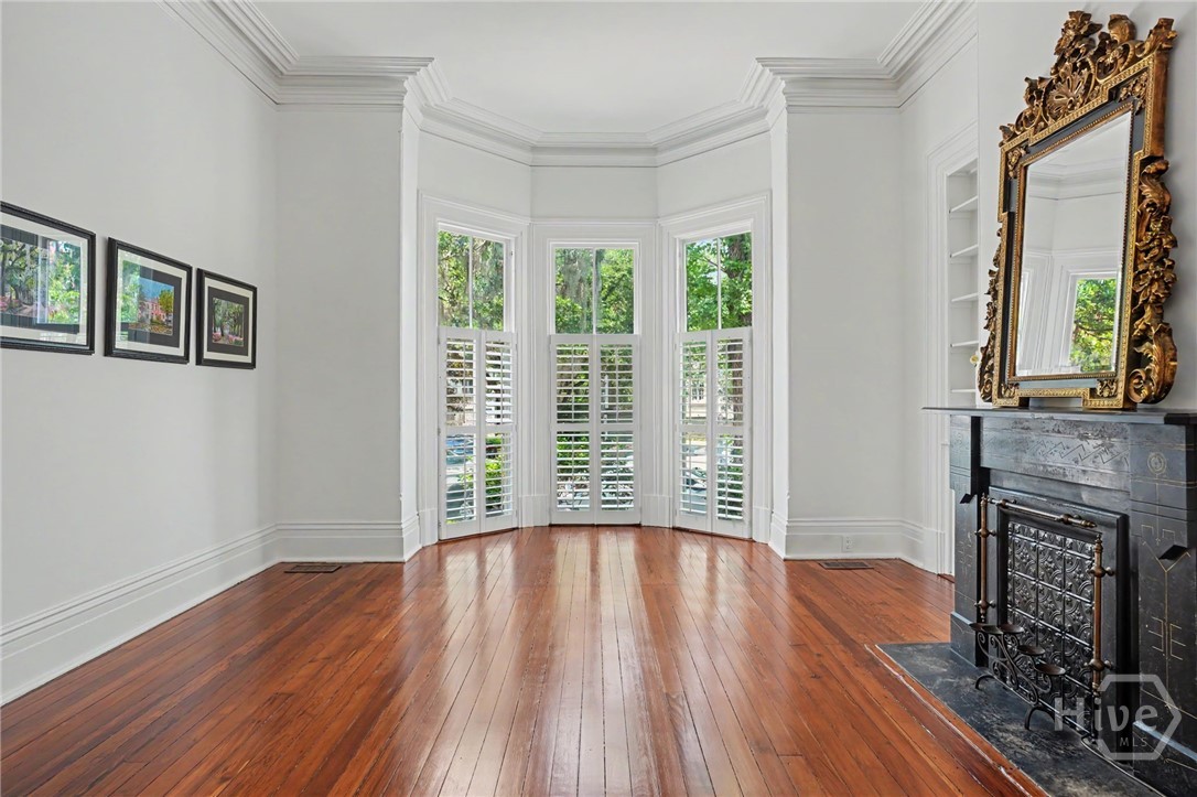 Original Victorian bay windows flood the interior with abundant natural light