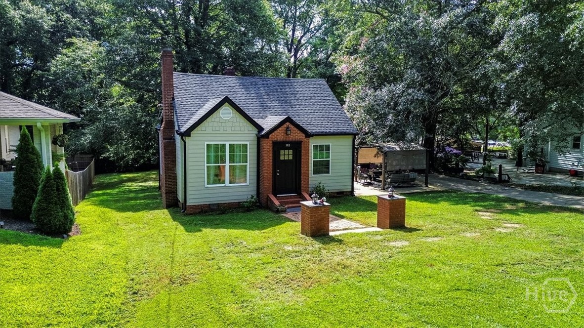 With fall in the air and Georgia football season officially underway, this home places you just steps from all the action. Located within walking distance of some of Athens’ most beloved restaurants, coffee shops, and entertainment spots, you’ll enjoy the perfect blend of convenience and community. Whether it’s grabbing brunch at a local favorite, enjoying a casual dinner, or exploring the vibrant neighborhood scene, everything you love about Athens is right at your doorstep.

Of course, Sanford Stadium—where the Dawgs hunker down on Saturdays—is just around the corner, making this an ideal spot to soak in the excitement and energy of game day weekends.

Step inside and you’ll immediately notice the charm, warmth, and thoughtful updates that make this house truly special. Classic details that stand the test of time pair seamlessly with modern touches designed for everyday living. The comfortable and versatile floor plan offers plenty of flexibility for any lifestyle, whether you’re hosting family and friends, working from home, or simply enjoying quiet evenings in.

Outside, the freshly manicured lawn adds to the home’s curb appeal, while the spacious back deck is perfect for entertaining or relaxing after a long day. A private hot tub offers year-round enjoyment, whether you’re unwinding after a game or savoring a peaceful evening under the stars.

Nestled on a quiet, tree-lined street, 183 Parkway Drive blends location, comfort, and charm in one remarkable package. Don’t miss your chance to own a piece of Athens living in one of the city’s most vibrant and historic neighborhoods.

Schedule your private showing today and make 183 Parkway Drive your new home!