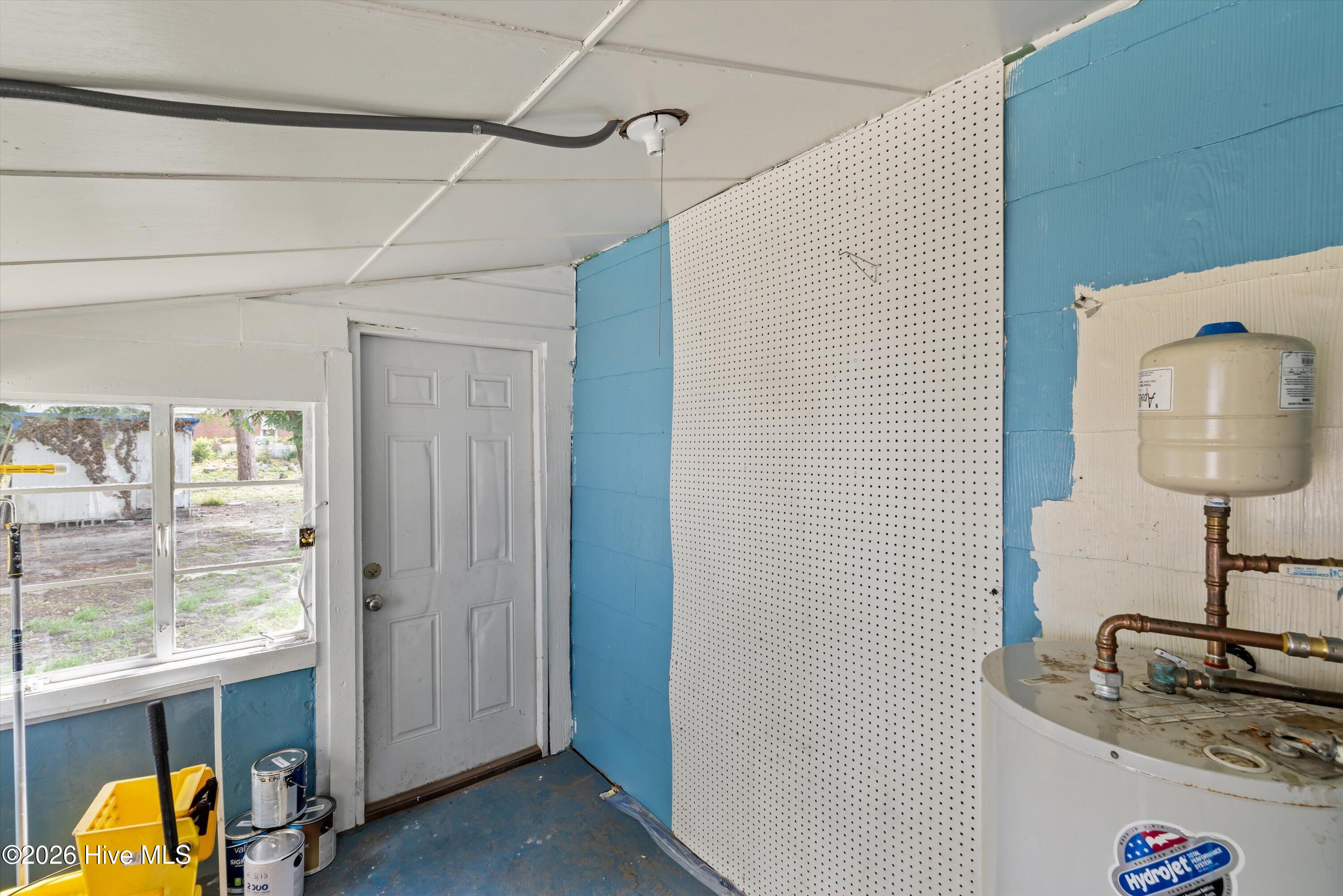 enclosed laundry porch off kitchen with access to back yard