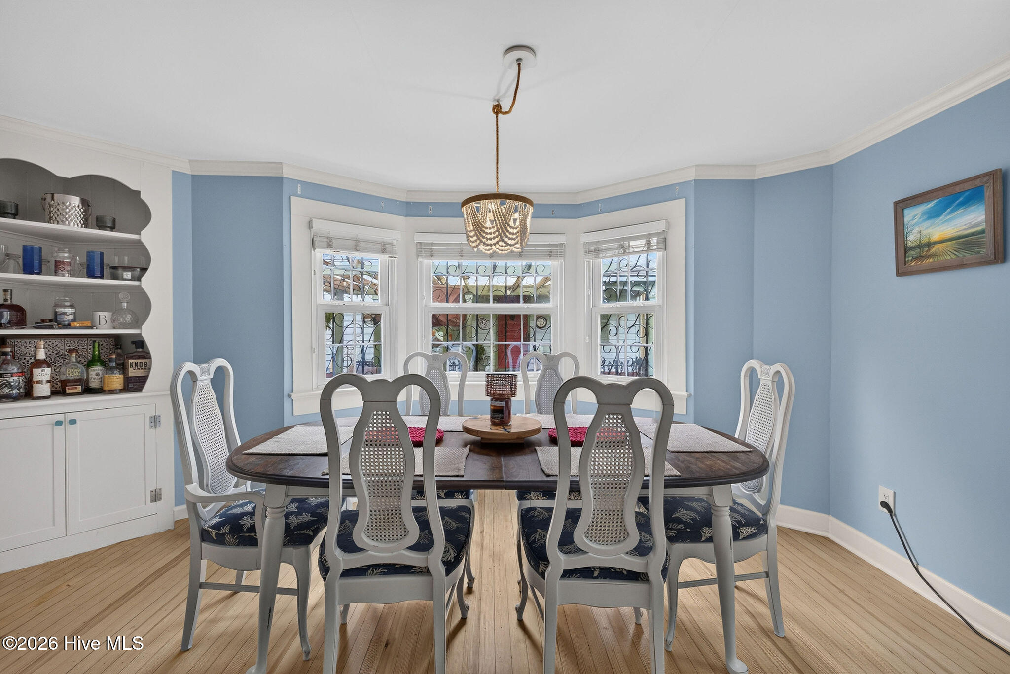 Formal ding room has built-ins and hardwood floors