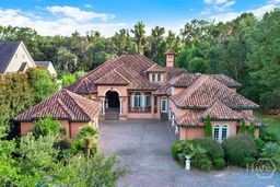 Spanish-style estate on 2.5 private acres in The E