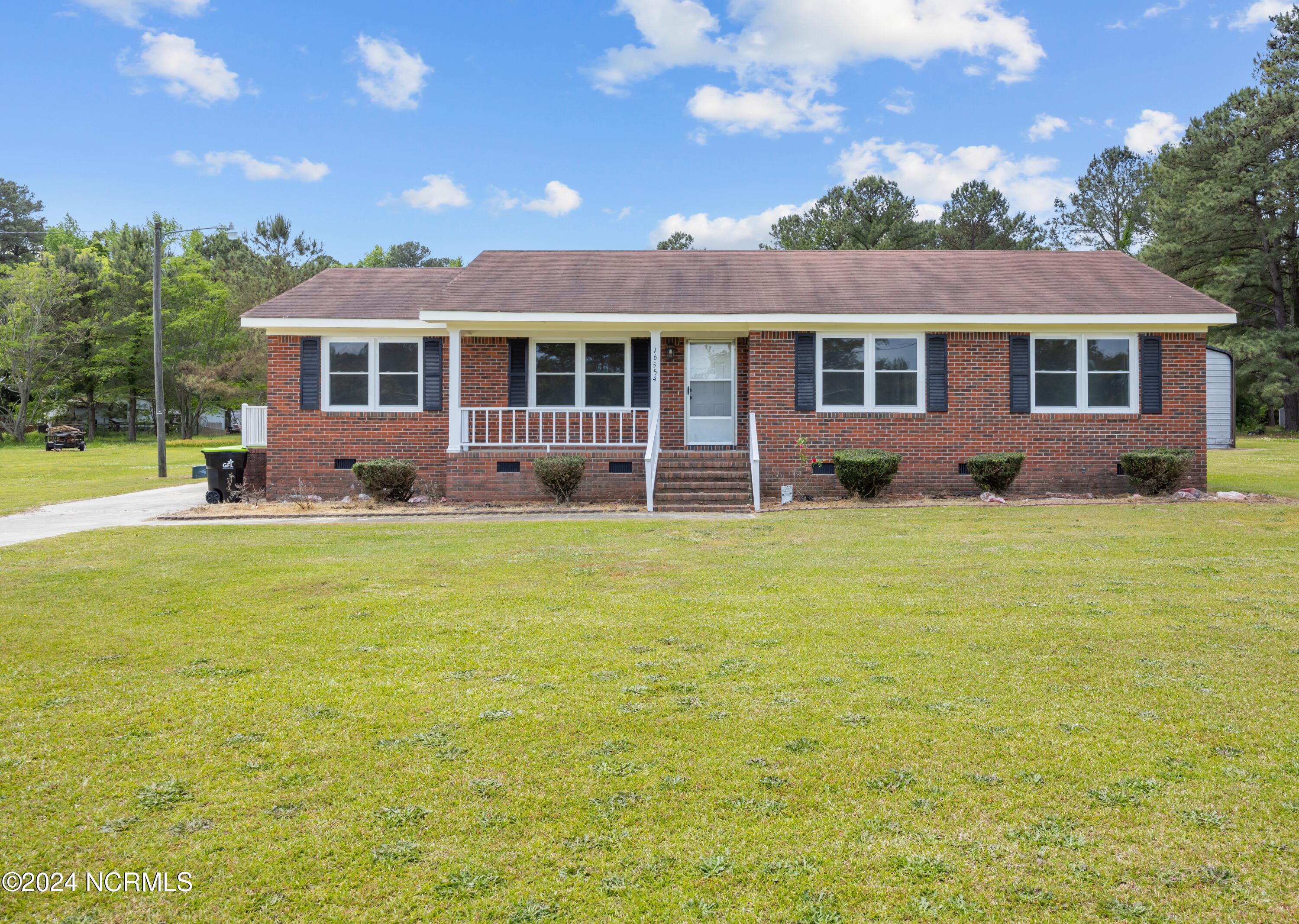 Explore this stunning brick residence resting on over an .5 acre of land. Fully renovated, featuring new windows, flooring, paint, new roof, upgraded electrical panel, countertops, AC trunk, lighting, ceiling fans, vanities, toilets, and more. Immerse yourself in the epitome of country living. Additionally, two buildings, measuring over 1500 and 550 square feet respectively, are included with the property. Parcel 0901086-02 and 0901086-03. Seller are very motivated to sell.