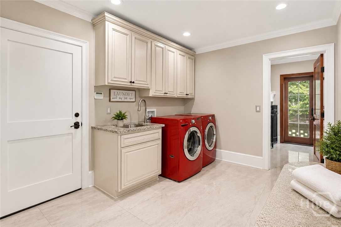 Laundry room, indoor kennel on the right, garages through door on left.
