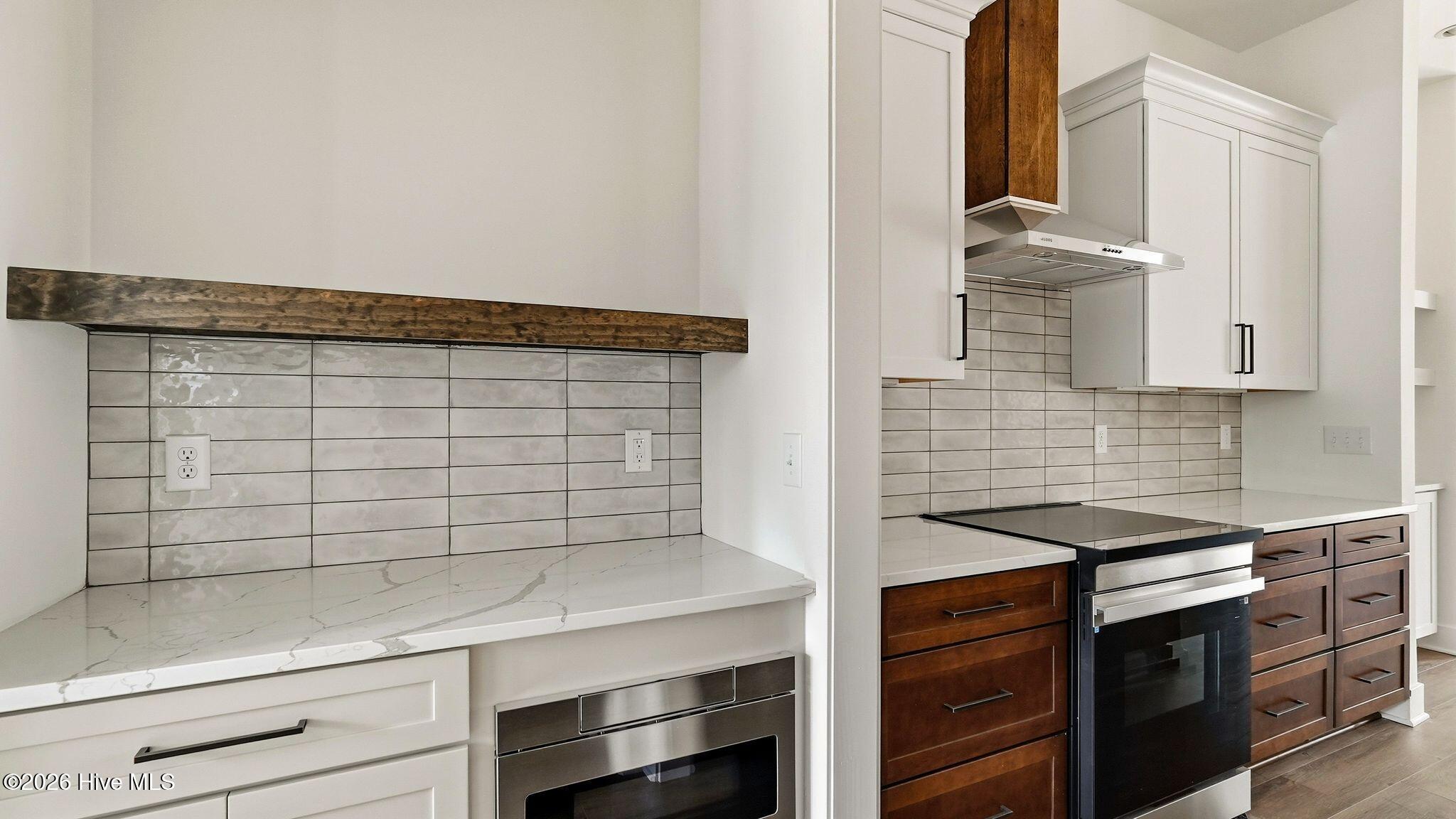 Butler's pantry with extra counter space and built-in microwave