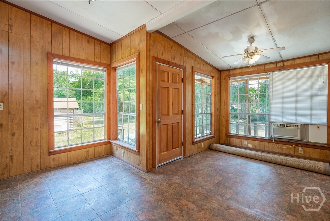 BEFORE - Covered patio/sunroom that was removed, kitchen addition now occupies this area